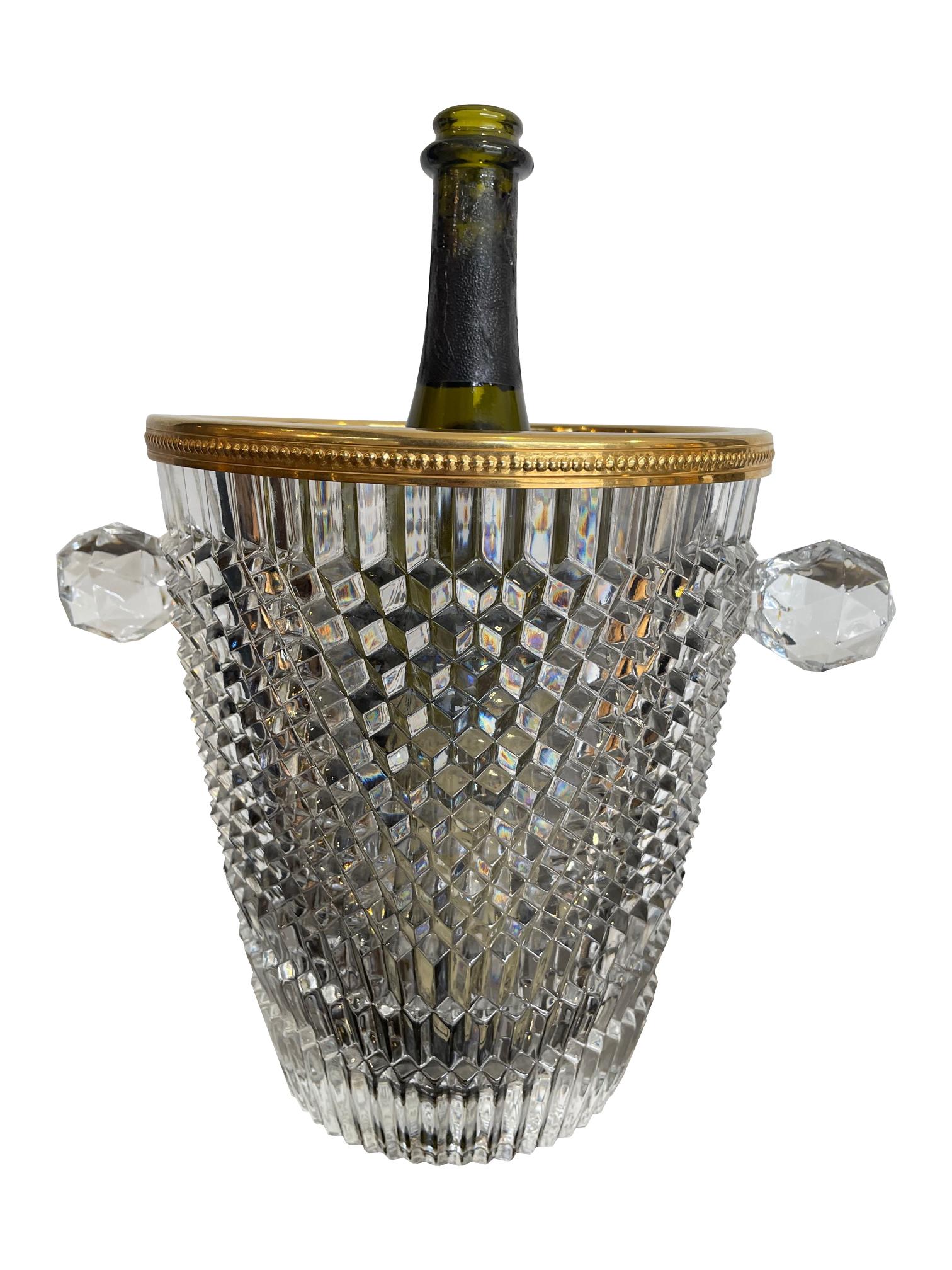 A 1950s Val St Lambert faceted crystal champagne bucket with gold plated detailed rim and faceted crystal handles. 

Glasses in the photos are not included inn the listing.