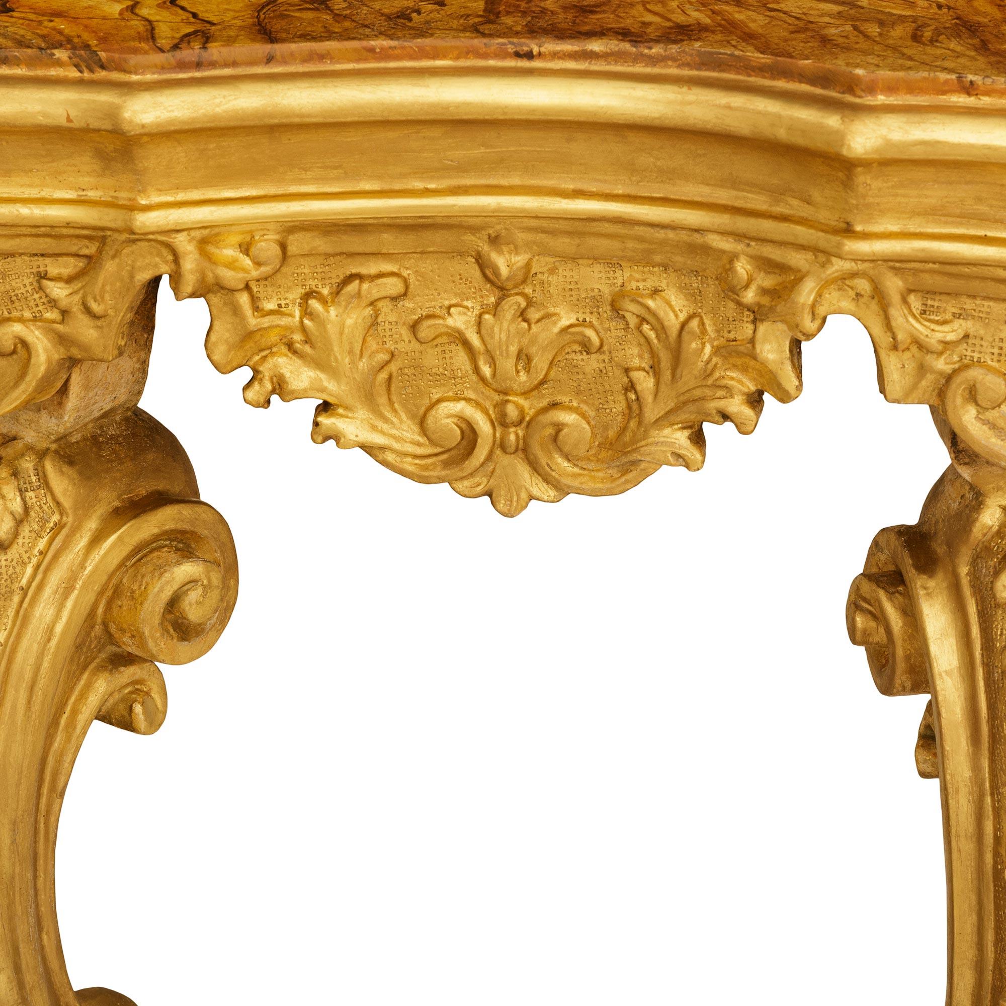 Marble A Venetian 18th century Giltwood and faux painted marble console For Sale