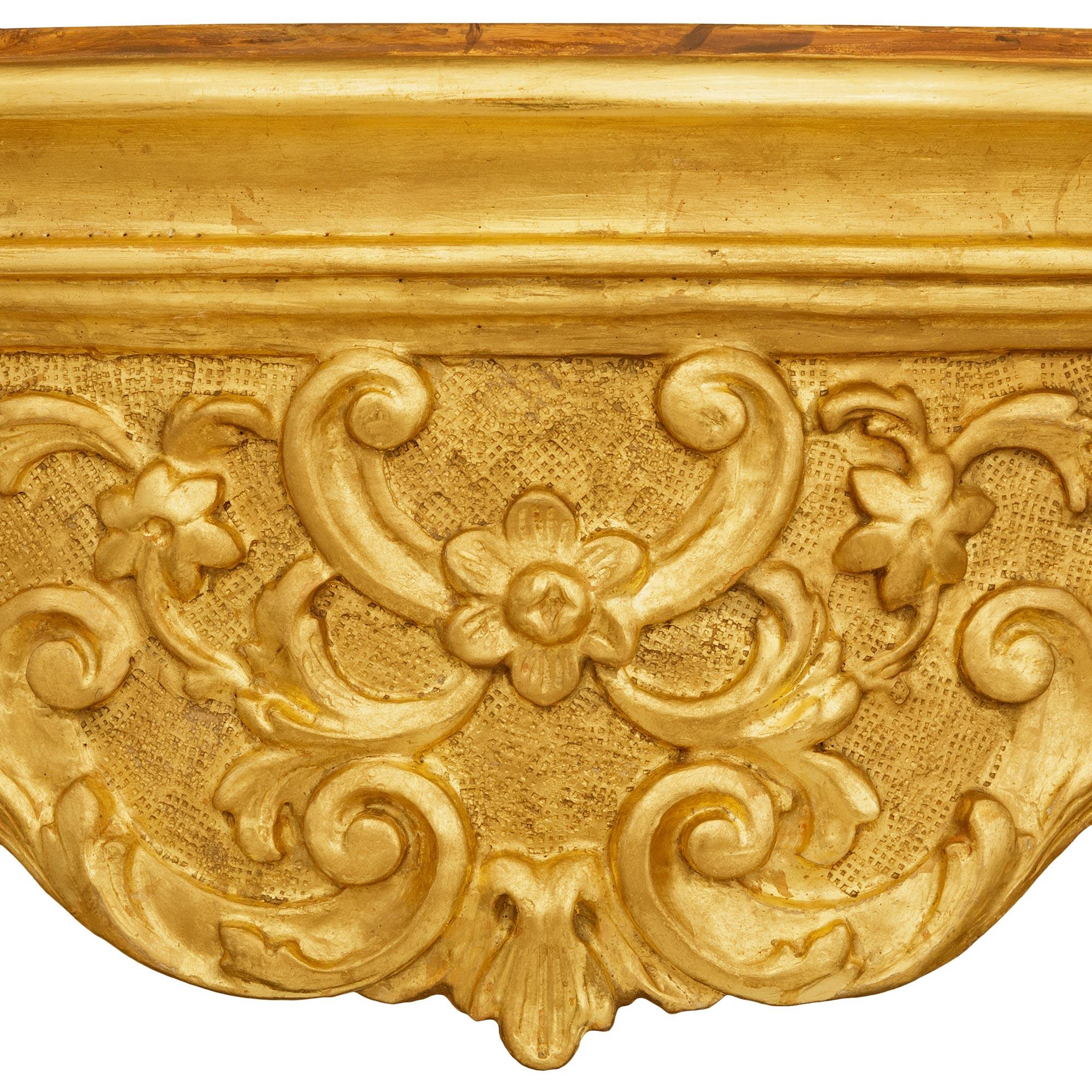 A Venetian 18th century Giltwood and faux painted marble console For Sale 1