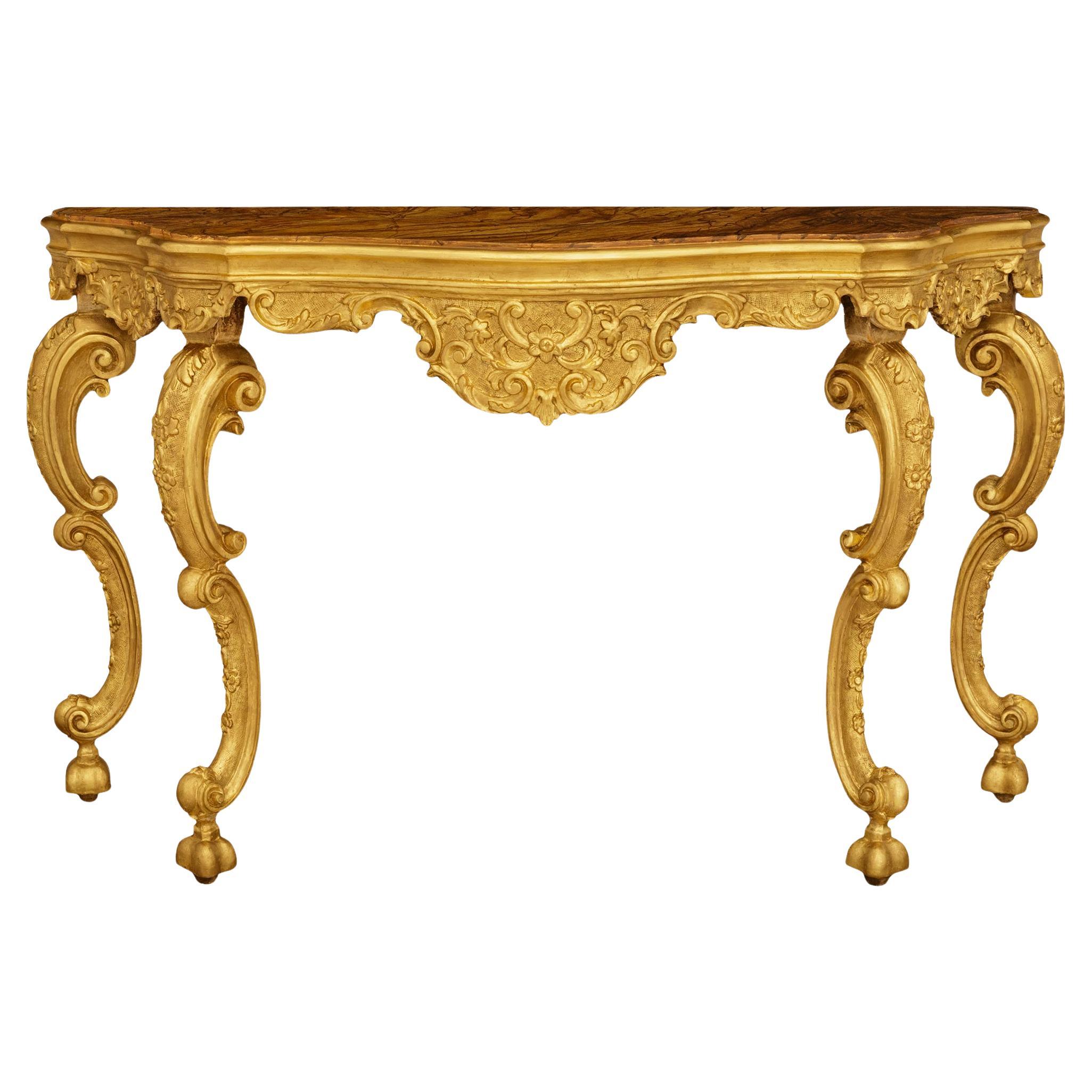 A Venetian 18th century Giltwood and faux painted marble console