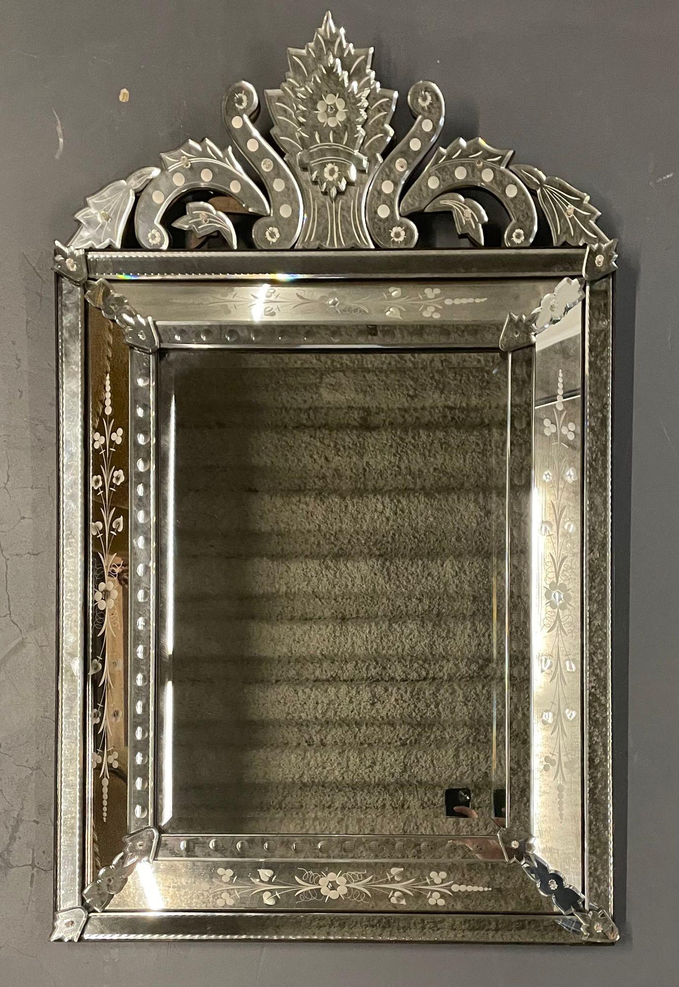 A Venetian Etched glass, beveled wall, console or pier mirror
 
A shimmering and bouyant venetian etched glass wall, console or pier mirror articulated by an all around beveled design. Accented by shadow-box sides and a finely crafted pediment