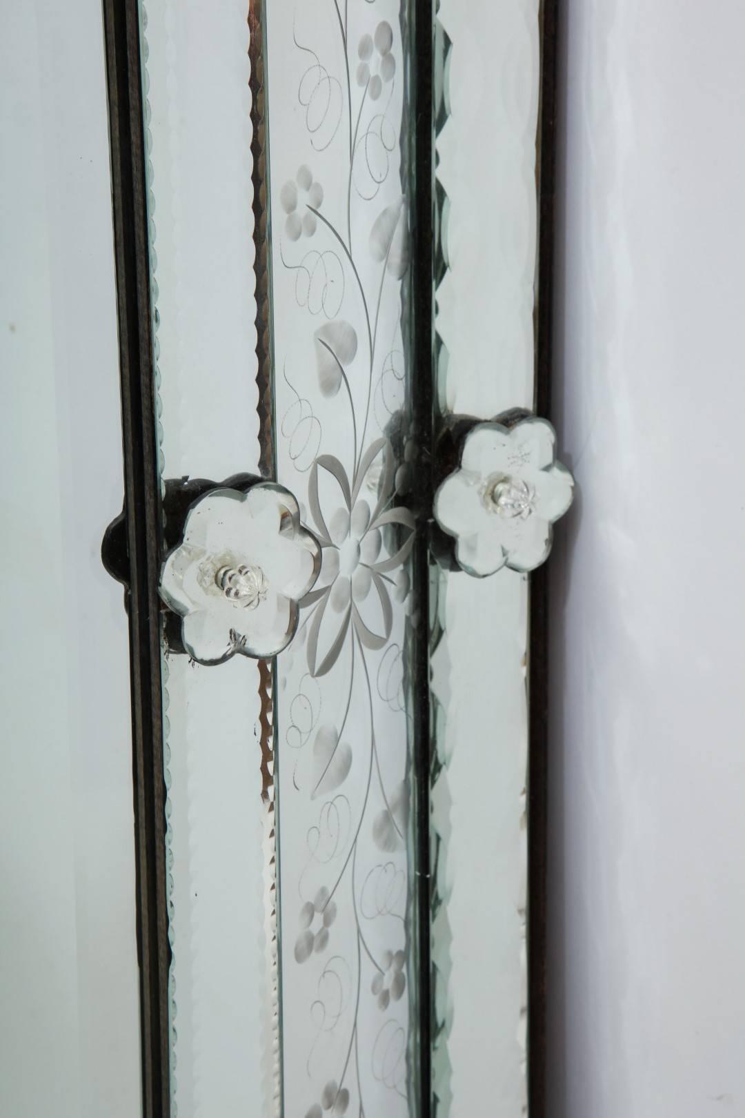 A Venetian etched-glass mirror.
