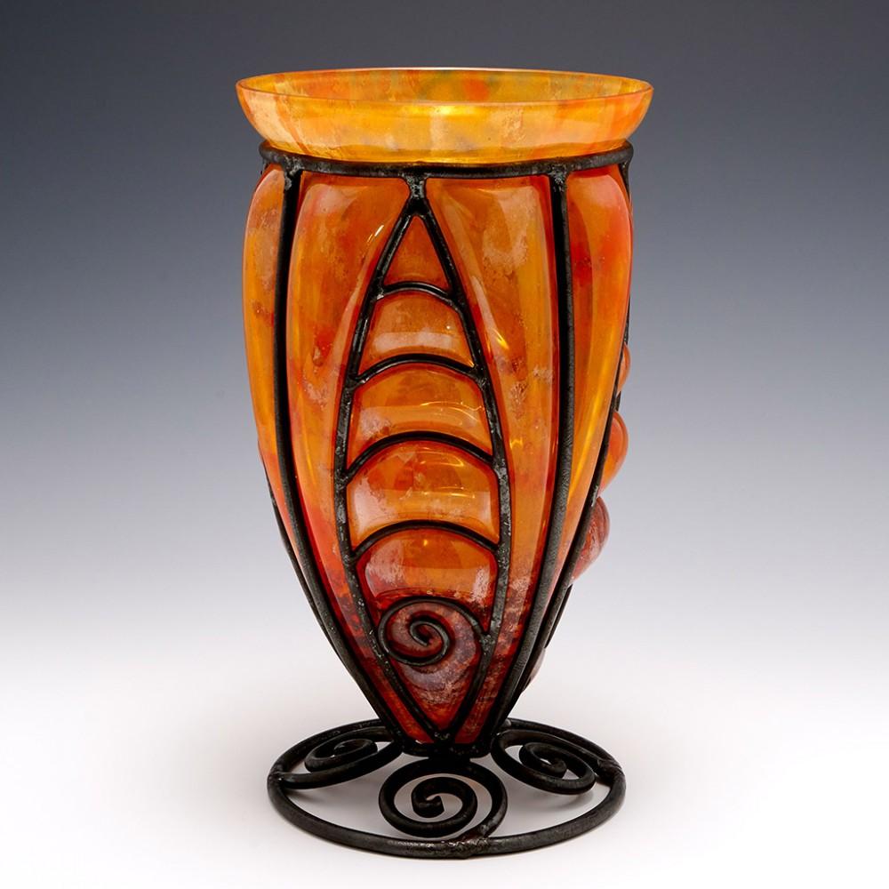 A Verrerie D'Art Lorraine Glass With Wrought Iron Frame, c1925

Additional Information:
Heading : A Verrrerie d'Art Lorrain vase with Majorelle type wrought metal mounts
Date : Circa 1925
Origin : Croismare, France
Bowl Features : Mottled glass