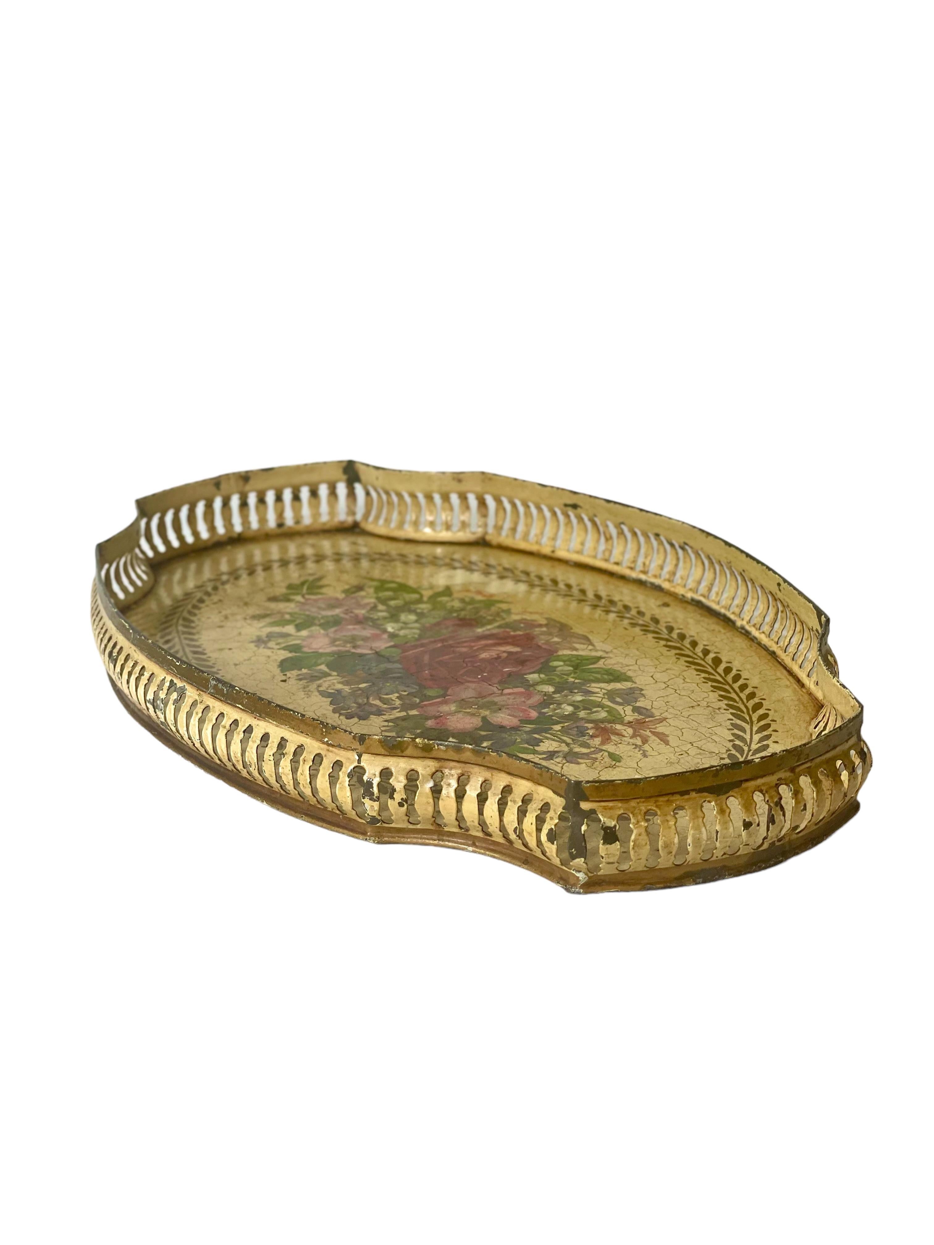 A very charming antique toleware tin tray, beautifully hand-painted with sprays of wild roses and a laurel frieze. The tradition of applying paint and lacquer to tin in this style began as a way of preventing everyday and household objects from