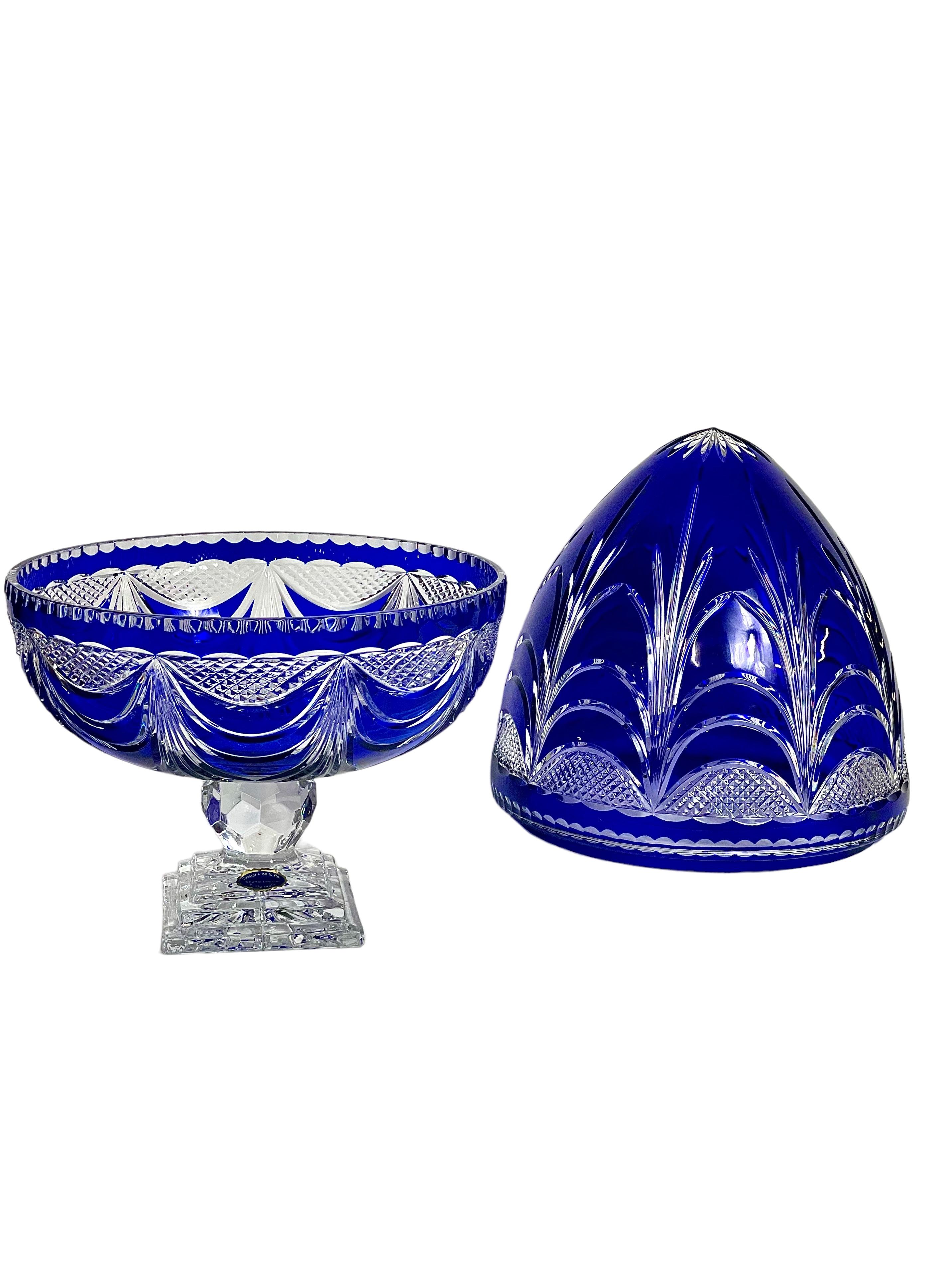 A very large and imposing cobalt-blue overlay cut-to-clear lead crystal Champagne cellar. Styled in the manner of the famous Compagnie des Cristalleries de Saint Louis, this sumptuous piece stands on a solid, square pedestal, its egg-shaped top