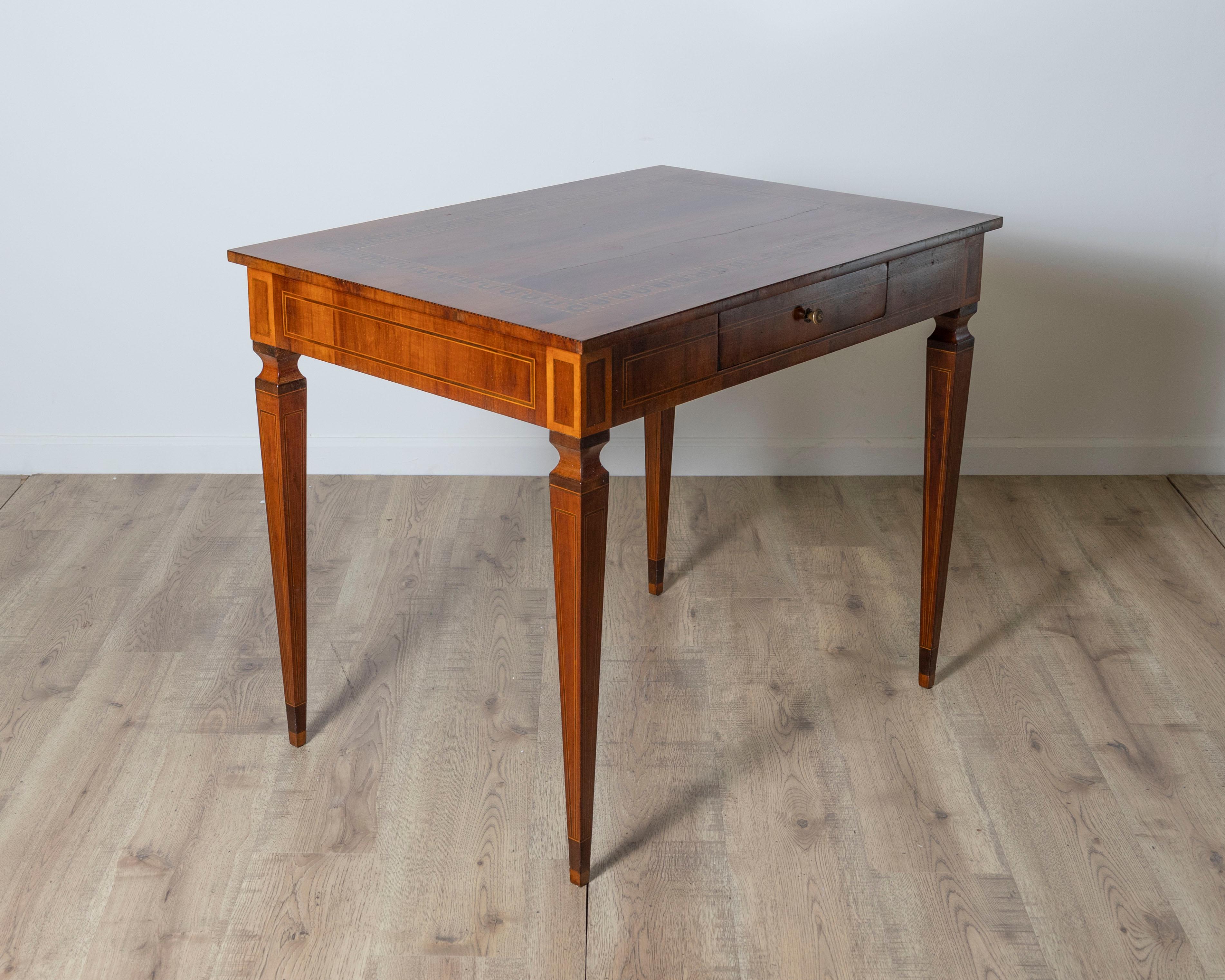 Italian A very elegant walnut table/desk with a central drawer For Sale