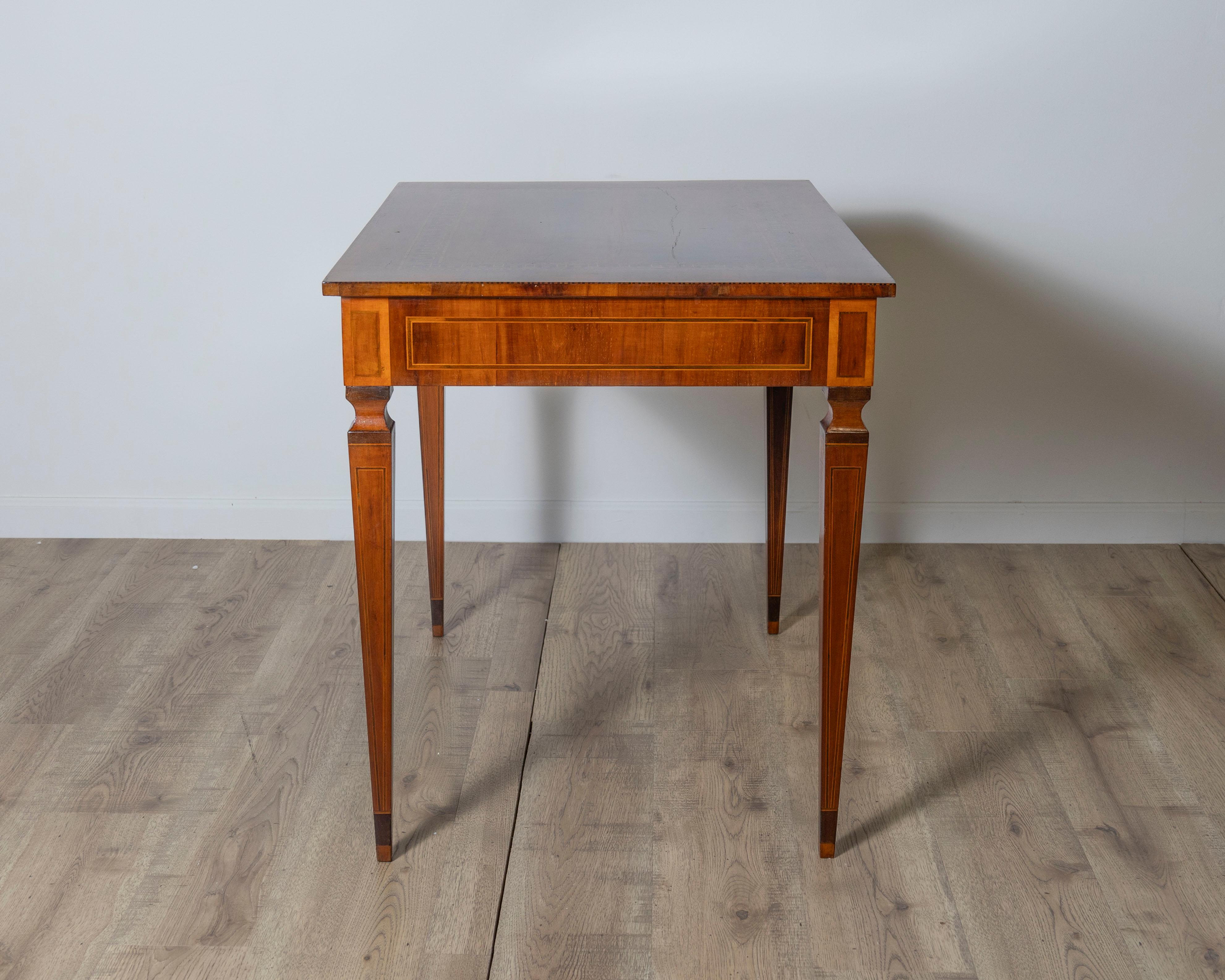 Walnut A very elegant walnut table/desk with a central drawer For Sale