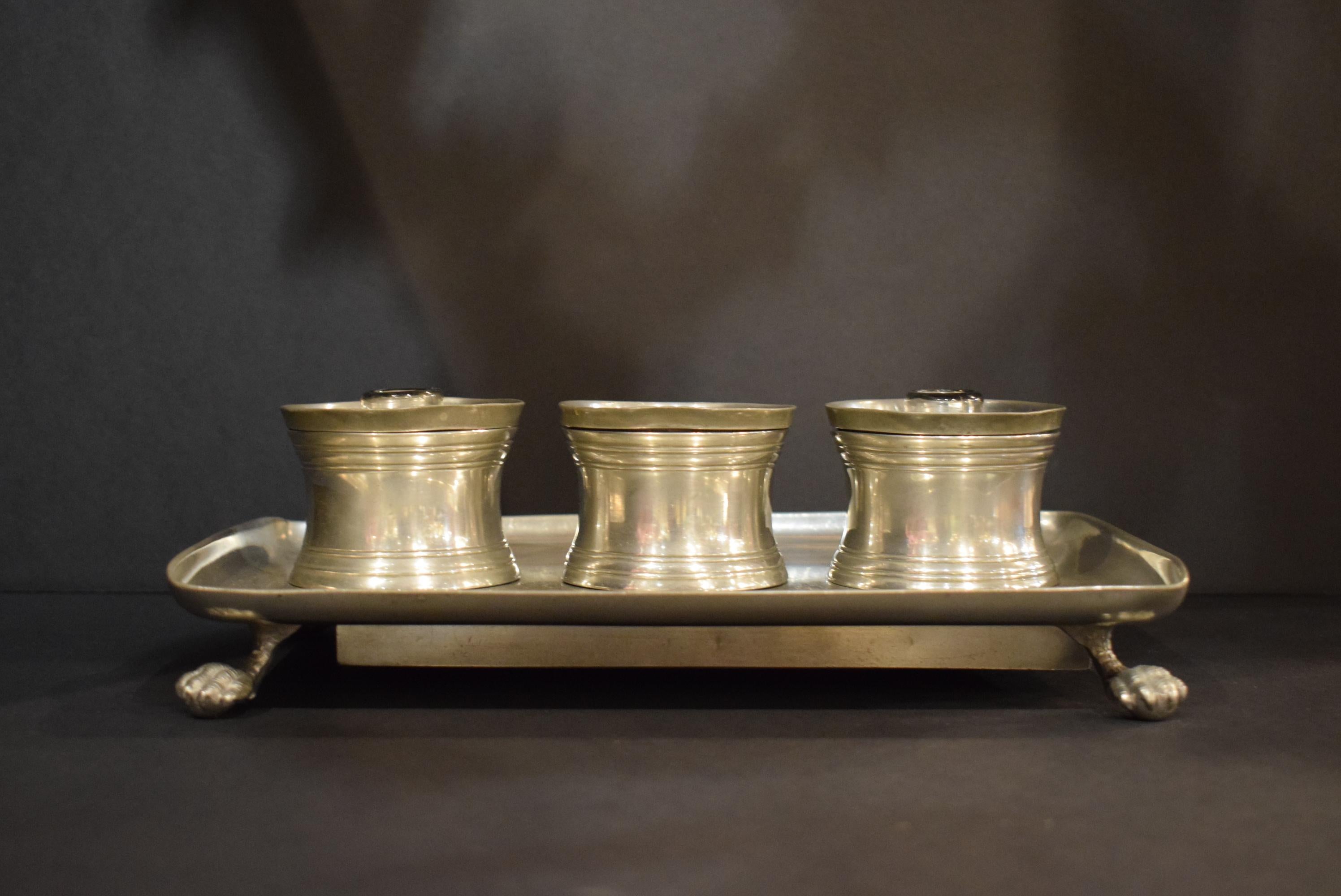 An English Pewter Inkwell, 19th century, the dished rectangular tray with two cylindrical ink pots and a covered jar, raised on animal paw feet.
Measures: Height 3 1/4 x length 11 x depth 6 7/8 inches. CW4741.

  