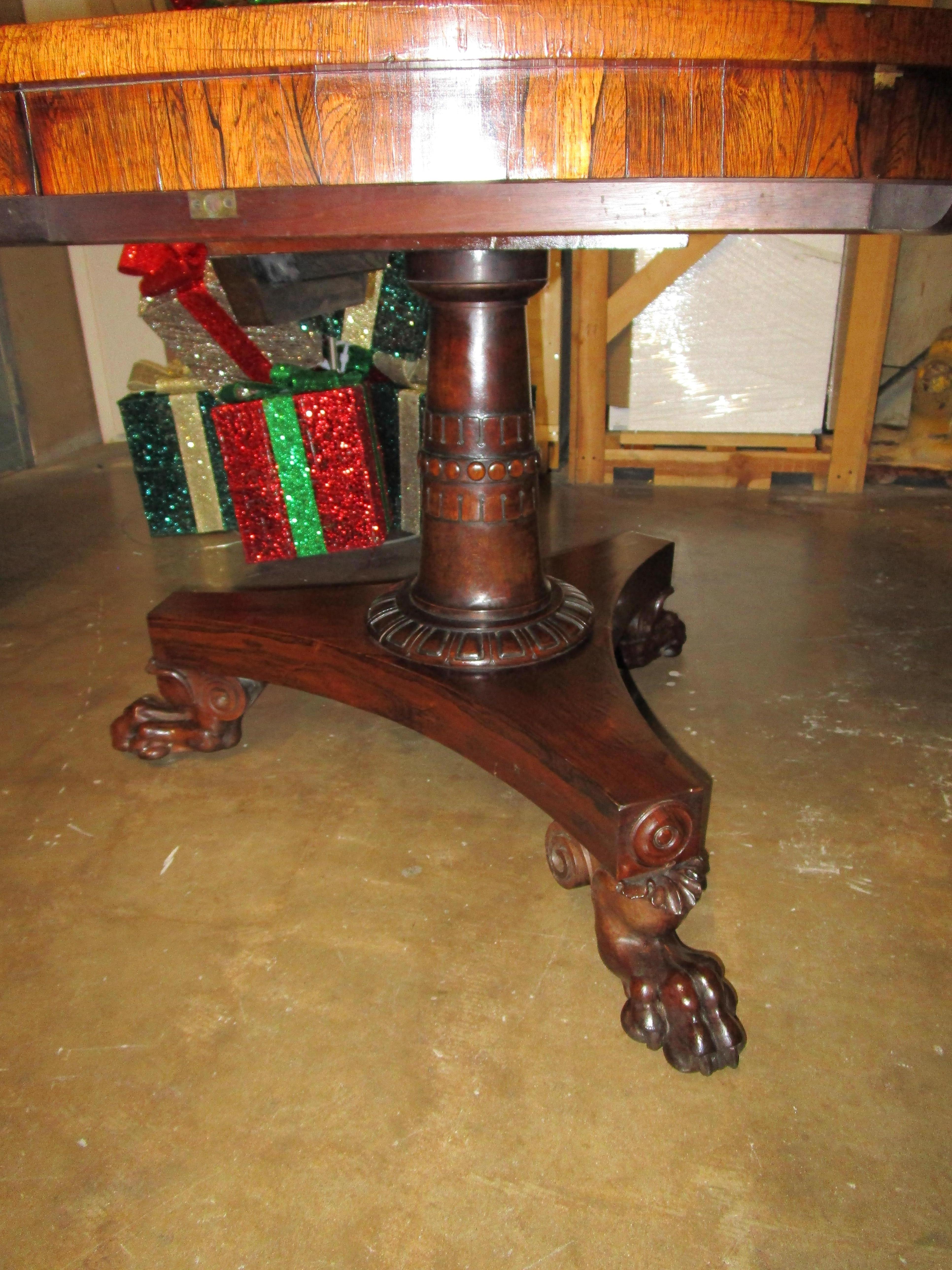 A very fine 19th century hand carved Regency rosewood pedestal based center hall or breakfast table.