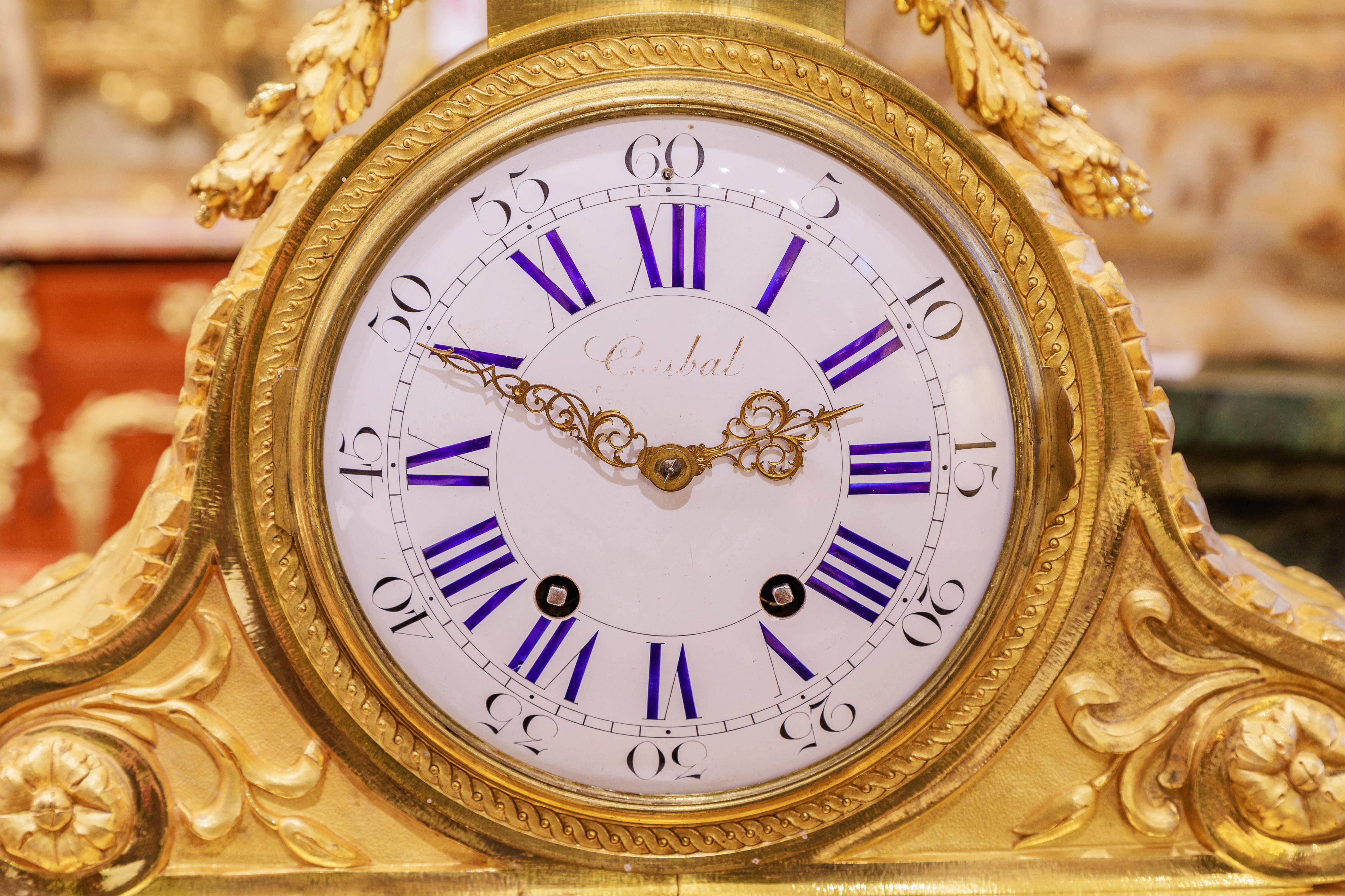 A very fine 19th century French Louis XVI gilt bronze mantle clock . Signed by the clockmaker