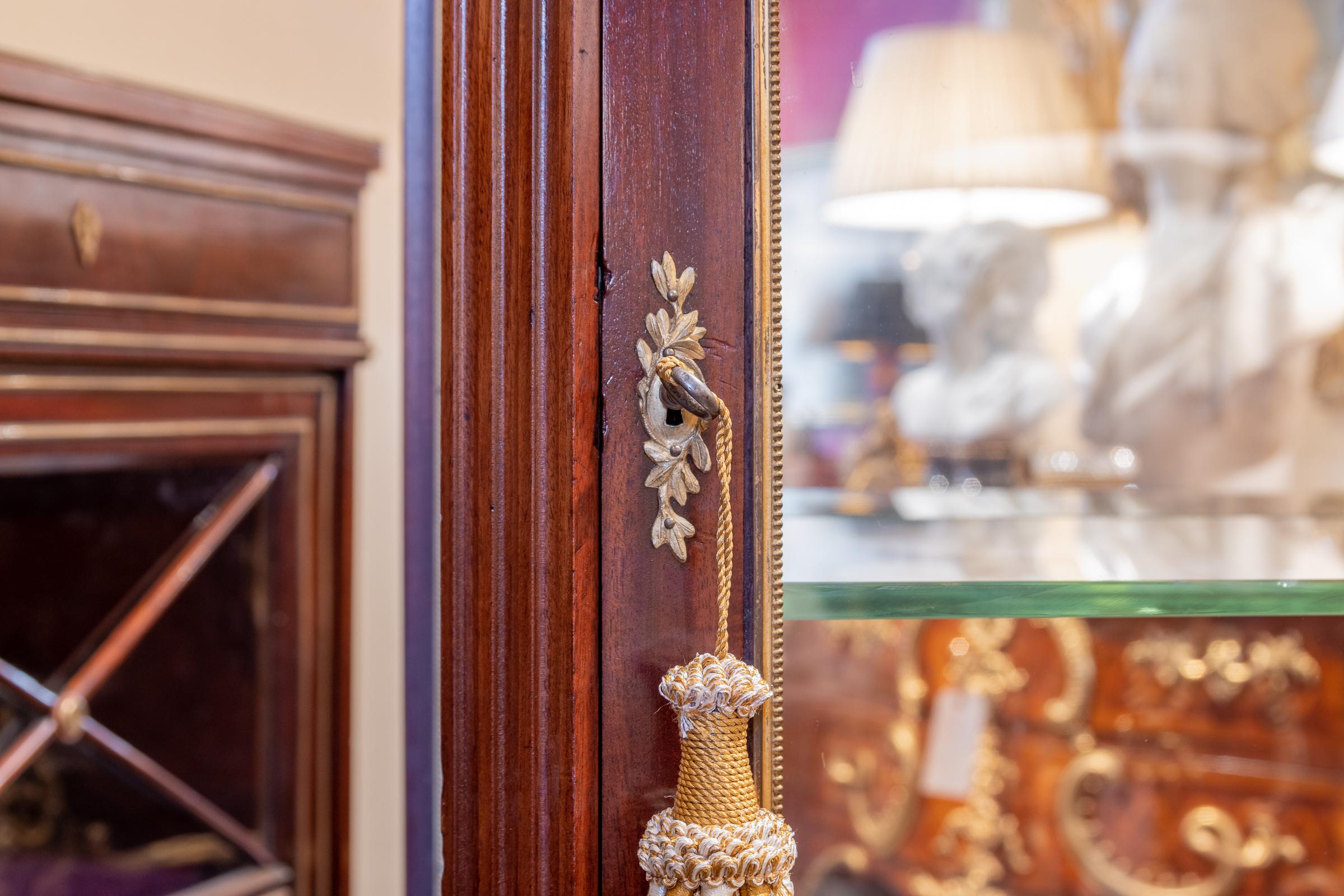 A very fine 19th century Linke quality Louis XVI mahogany and gilt bronze vitrine. Carrara marble top with fine gilt bronze detail. Locks signed Duvivier Paris St Antoine.