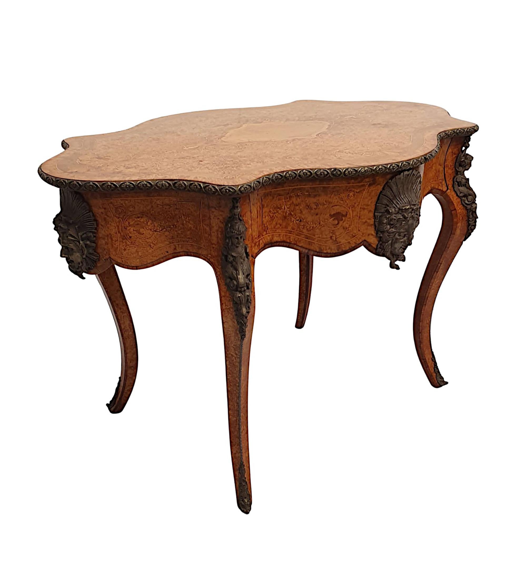 A very fine 19th century marquetry inlaid bird’s-eye maple desk or library centre table, finely carved, ormolu mounted, line inlaid and cross banded throughout and of gorgeous quality with beautifully rich patination and fine grain. The moulded,