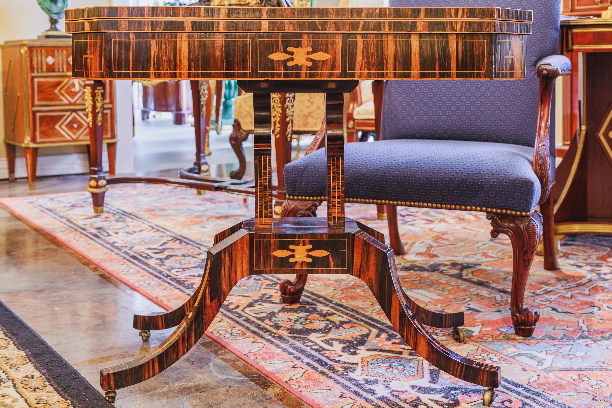 A very fine and rare 19th century English calamander and inlaid game table. Very fine quality.