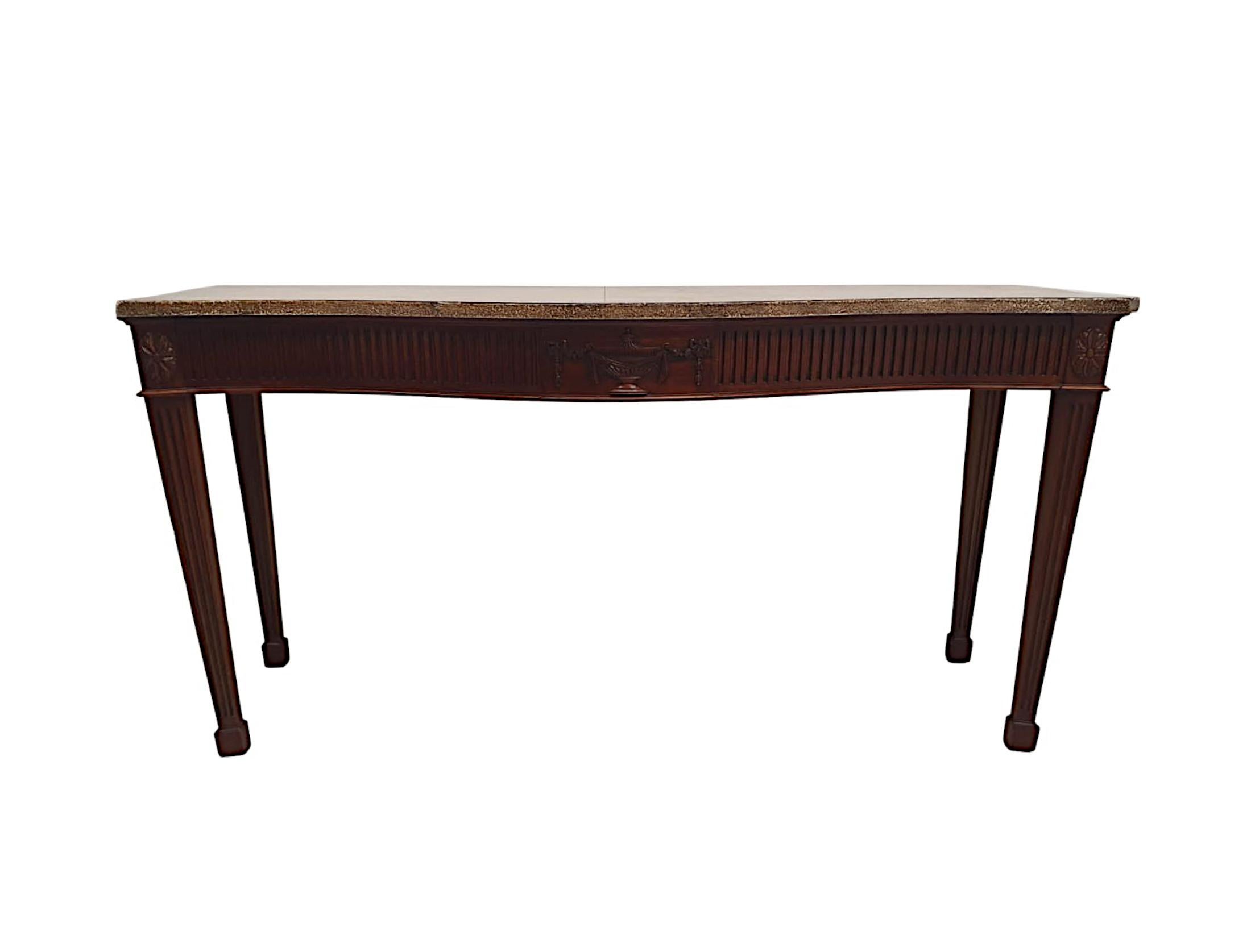A very fine 20th Century mahogany console or hall table in the manner of Adams, of exceptional quality and beautifully carved with rich patination, grain and adorned with intricately detailed Neoclassical motifs comprising of urn, linen swags,