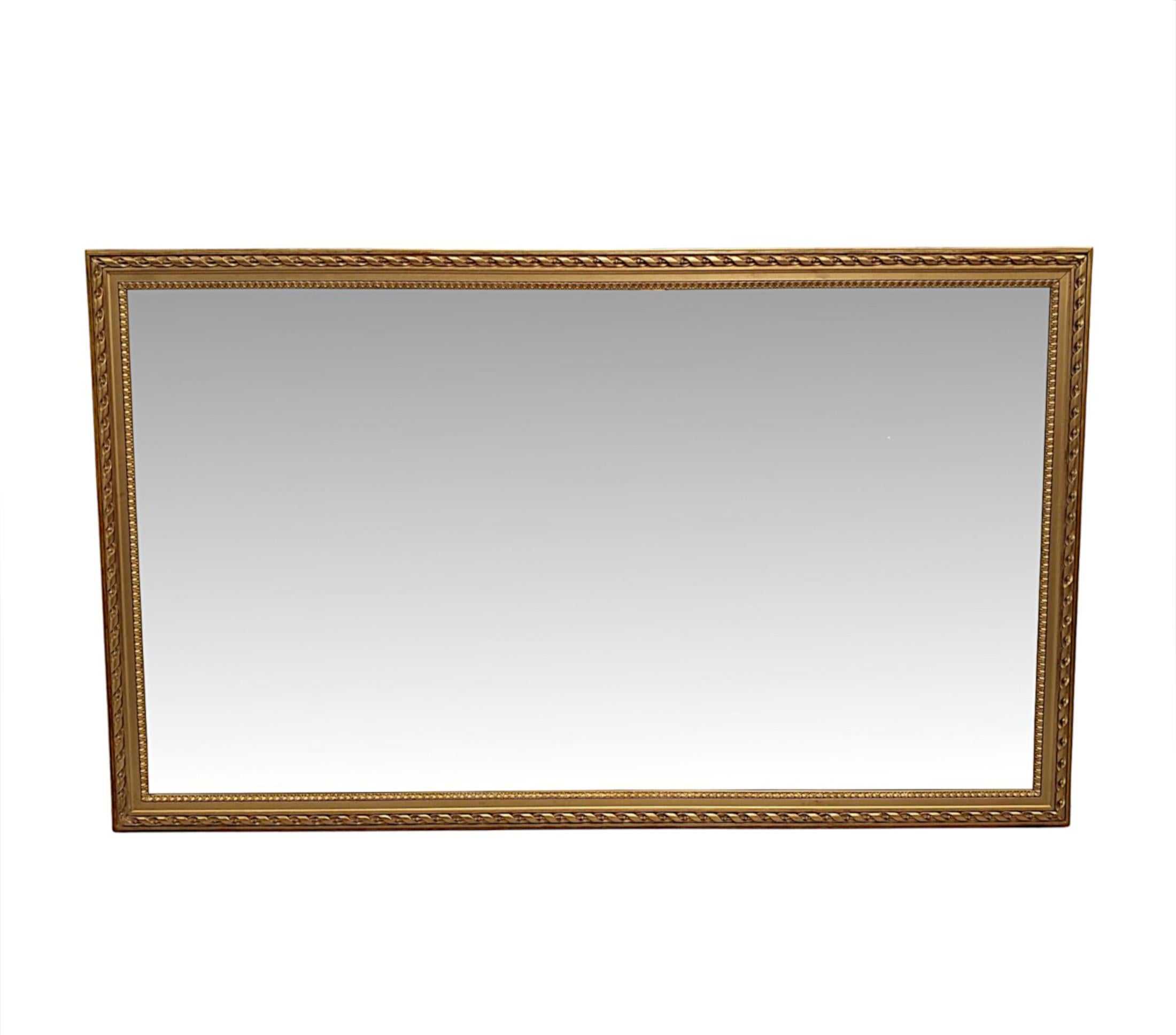 A very fine and elegant 19th century overmantle or hall mirror of exceptional quality and large proportions. The original bevelled mirror glass plate of rectangular form is set within a fabulously hand carved, moulded giltwood frame with gorgeous
