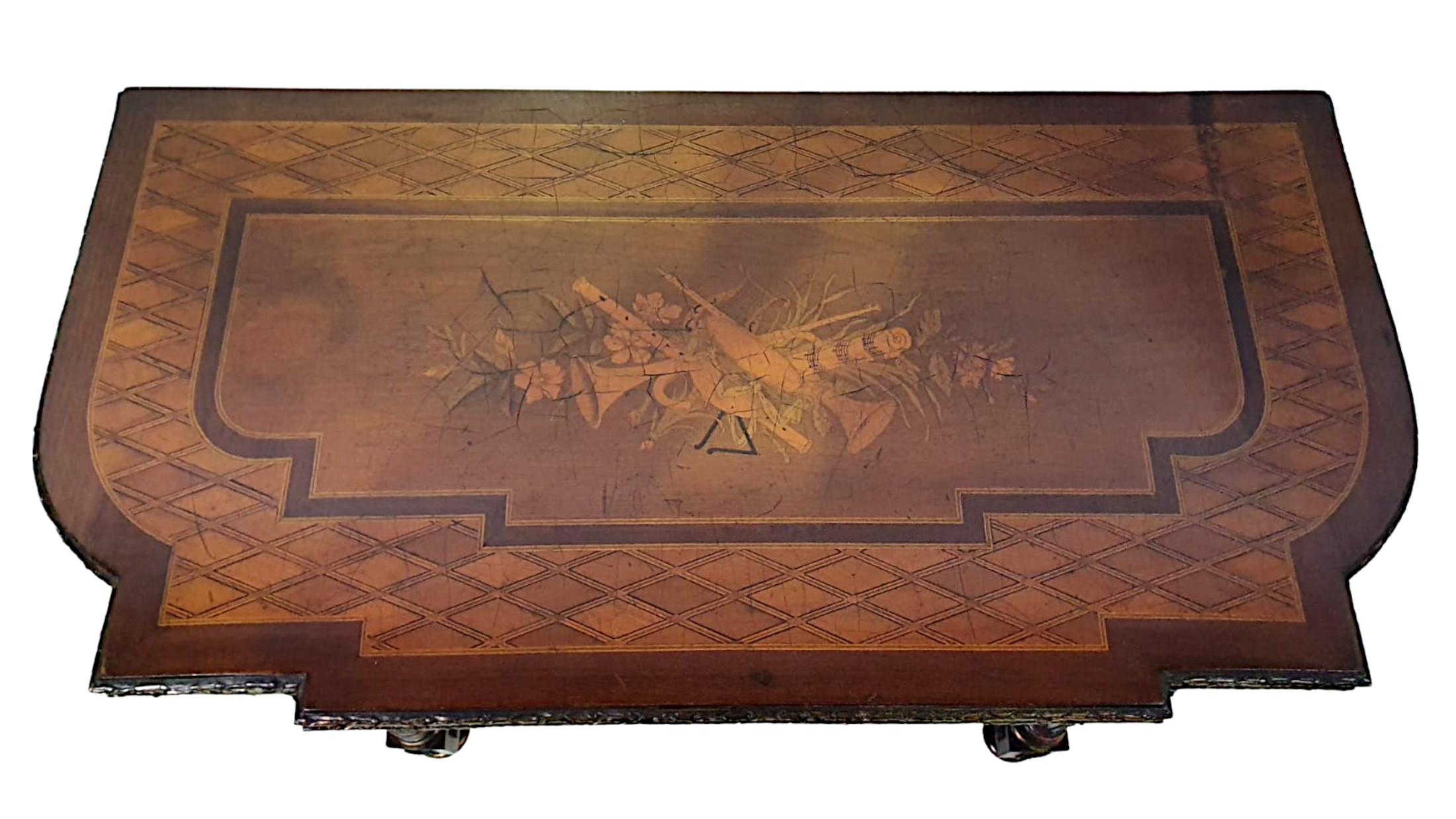 A rare museum quality 19th century marquetry inlaid turn over leaf card table with ormolu mounts thoughout. The shaped and moulded top of rectangular form with intricate marquetry inlay centred with a cartouche depicting musical instruments and