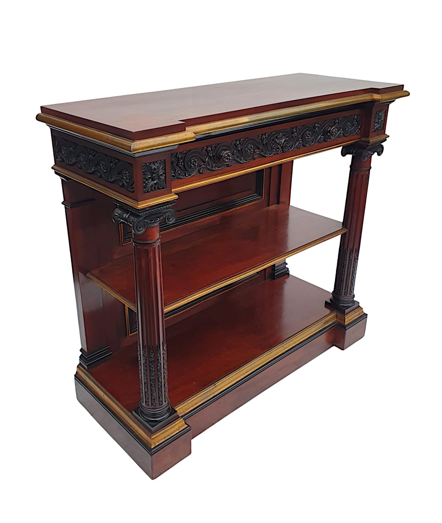 A very fine and rare 19th century mahogany two tier console table with brass mounts and ebonized detail throughout. The shaped and moulded top raised over frieze with single long drawer, intricately hand carved with guilloche, flowerheads, foliate,