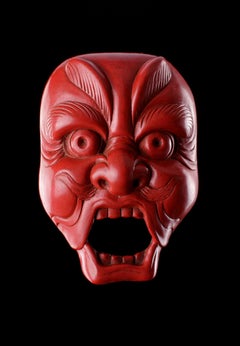A Very Fine and Unusual Carved Red Lacquer Netsuke