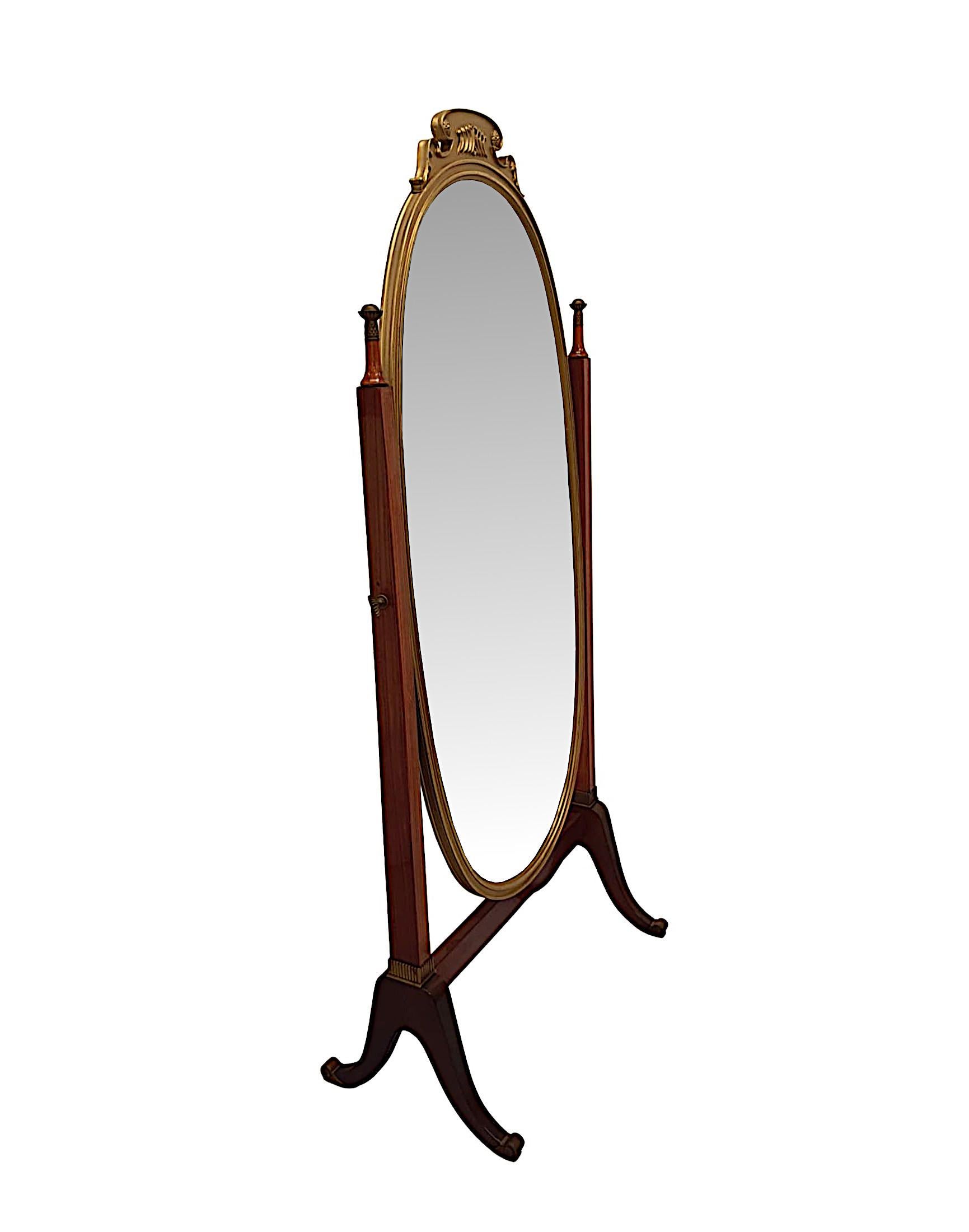 A very fine and unusual Edwardian fruitwood and giltwood framed cheval mirror, of exceptional quality, fabulously carved and line inlaid throughout with gorgeously rich patination and grain. The bevelled mirror glass plate of oval form is set within