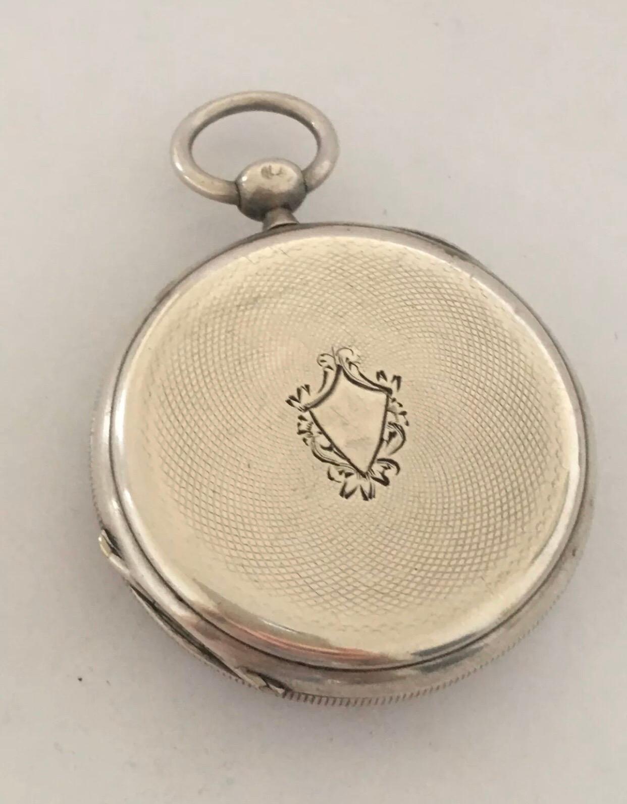 
This beautiful silver key-winding pocket watch is in good working condition. It has recently been serviced and it is ticking well. It comes with a winding key 