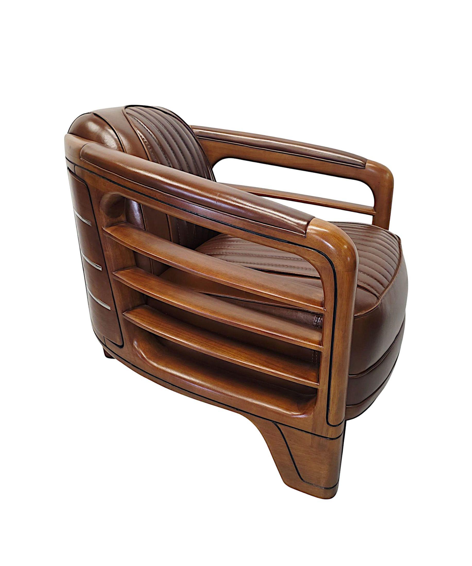 A very fine handmade leather and well figured walnut framed club armchair in the Art Deco style.  This exceptional piece is of superb quality with beautifully rich patination and grain.  Stunningly upholstered in an elegant brown leather with