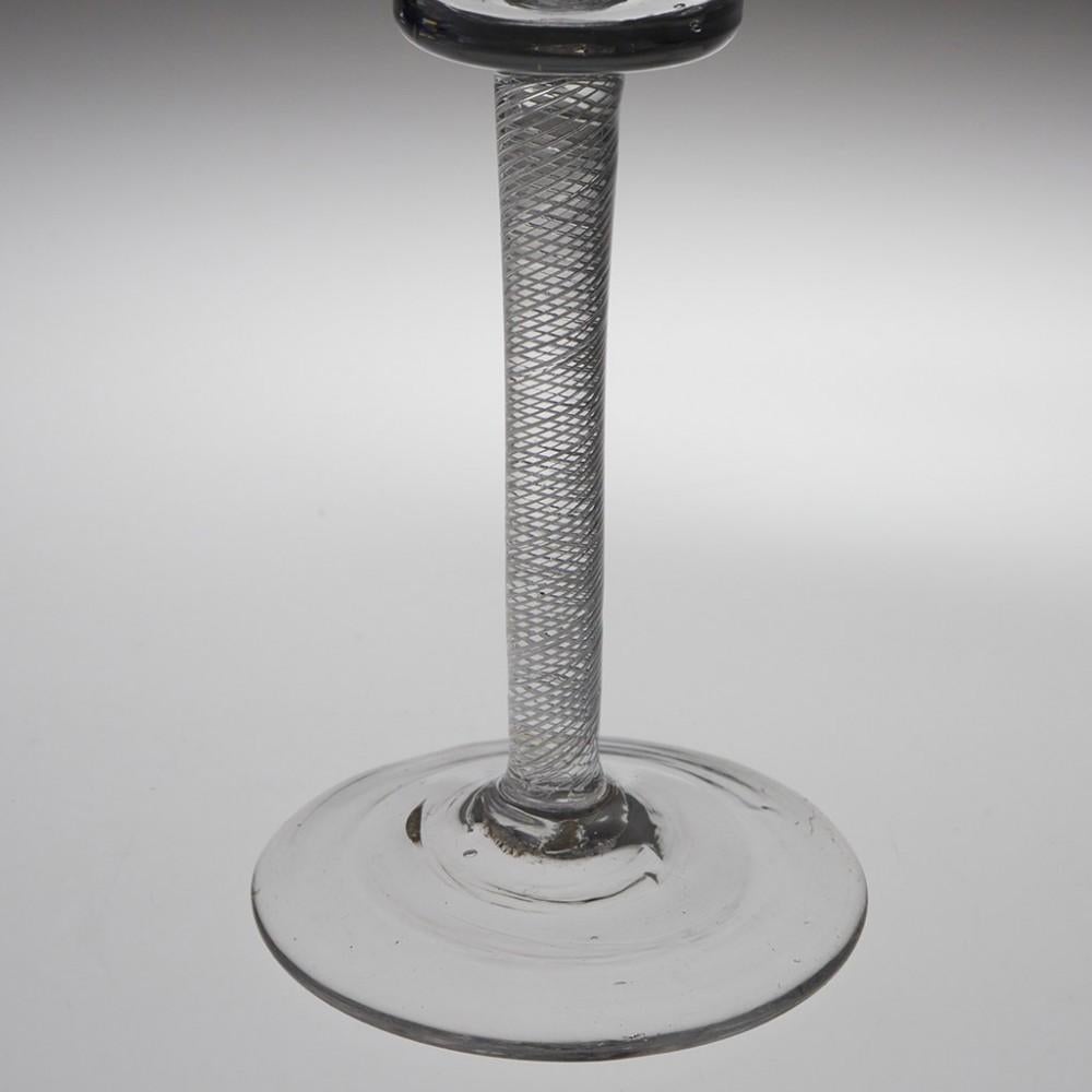 A Very Fine Bucket Bowl Multi Spiral Air Twist Wine Glass, circa 1760

Additional Information: 
Period: George II c.1750
Origin: England
Colour: Clear with good grey tone
Bowl: Bucket shape with good pucella marks
Stem: Tapered multi-spiral