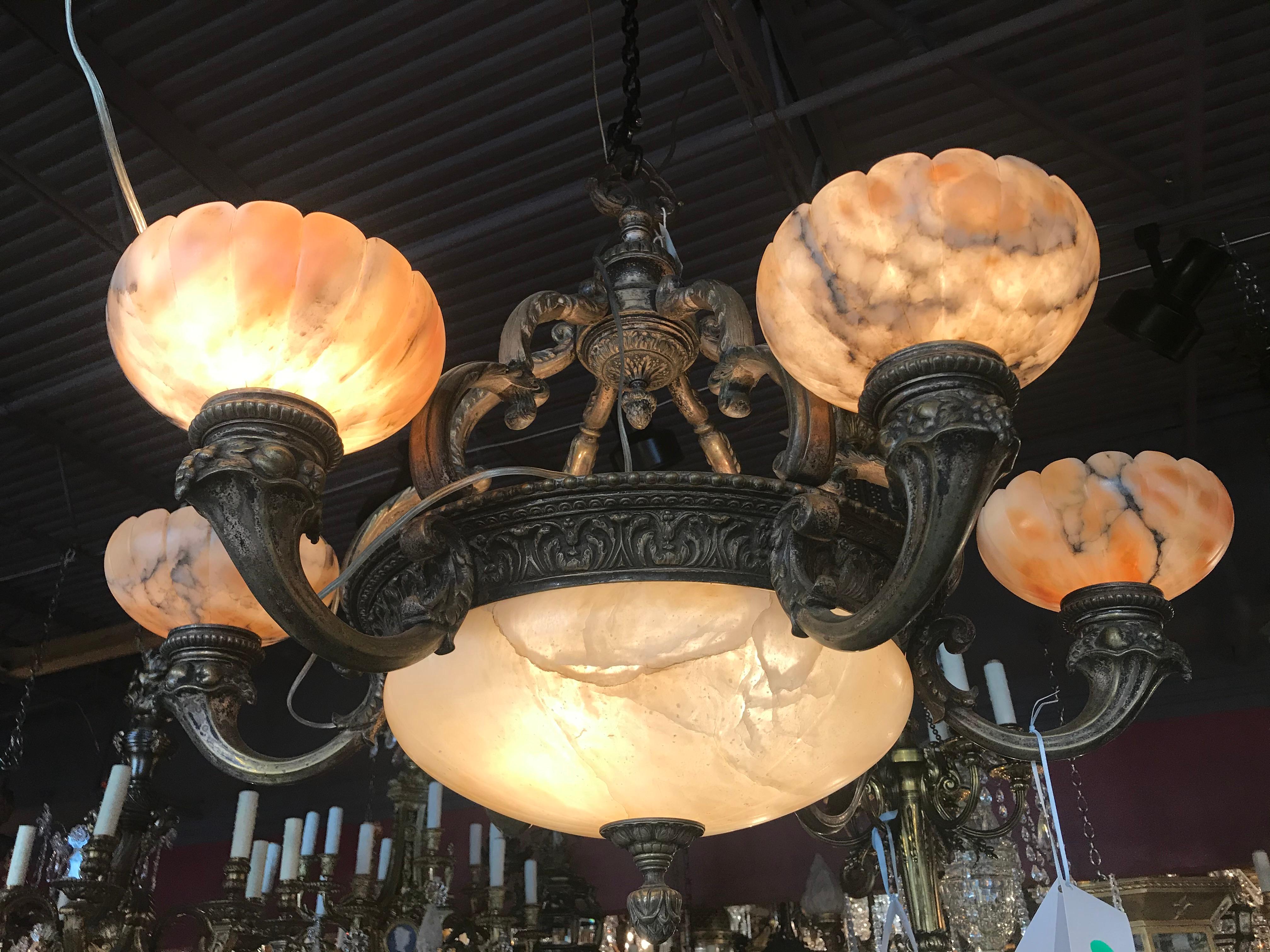 A very fine and decorative bronze chandelier with alabaster dome and shades.
France, circa 1920. 9-light.
Dimensions: Height 29