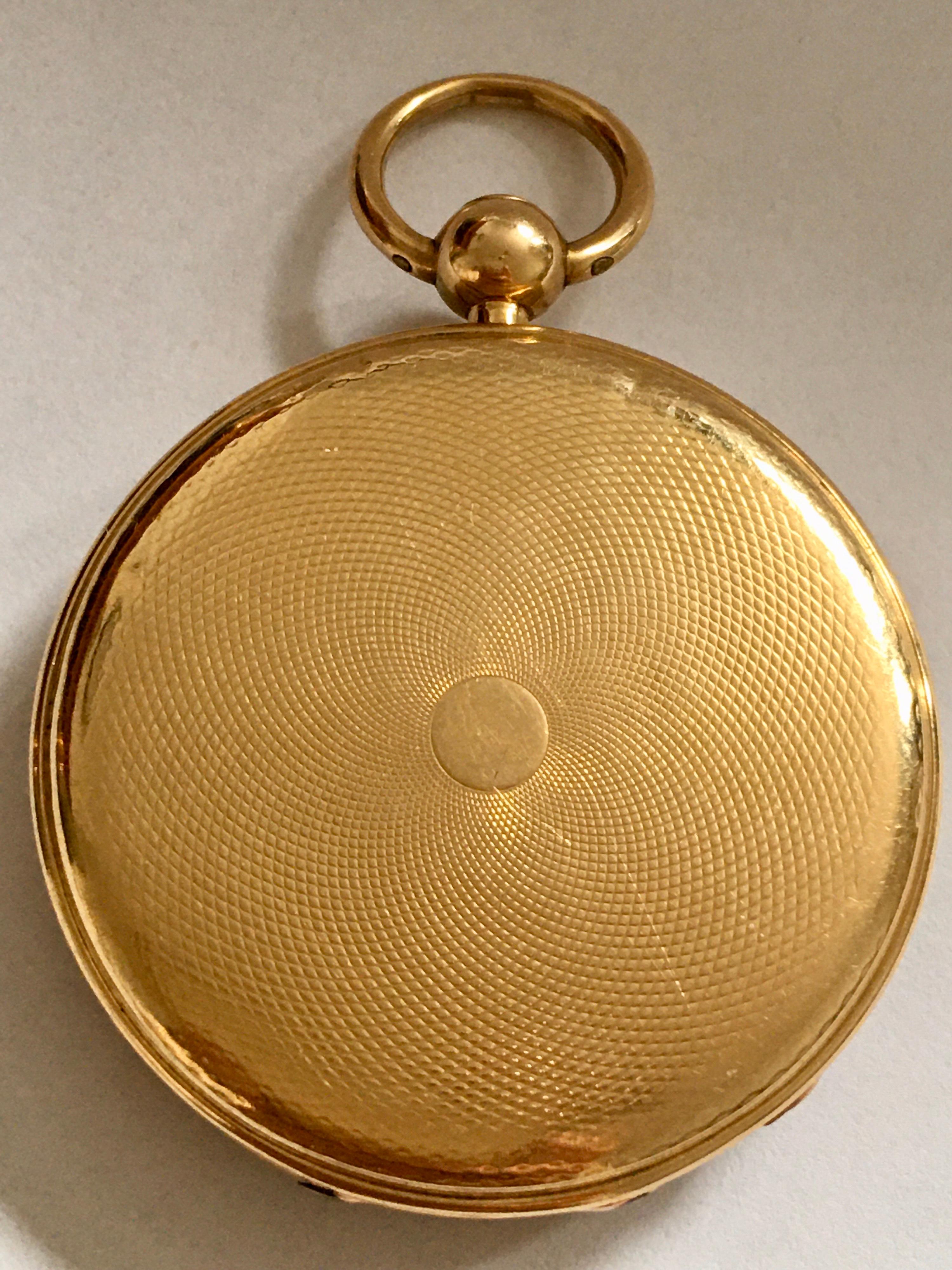 This beautiful and good quality 18K Gold & engines turn cased pocket watch is working and ticking well. The dial is a bit tired but runs well & been serviced. It comes with a winding Key