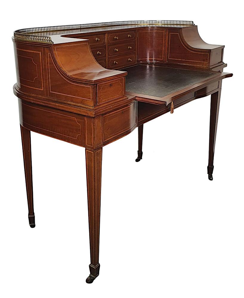 A very fine Edwardian mahogany Carlton House desk with line inlay throughout. The moulded and curved upper section with three quarter pierced brass gallery above an arrangement of six drawers with brass pulls flanked by a pair of concave doors. The