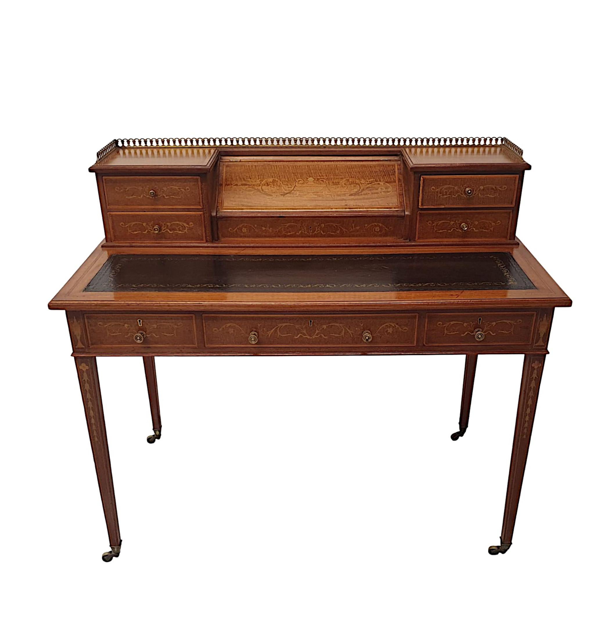 A very fine Edwardian richly patinated mahogany desk attributed to Edward and Roberts. Line inlaid throughout and with fabulous marquetry detail depicting Neoclassical motifs of urns, scrolling foliate, flowerheads and trailing bell husks. The