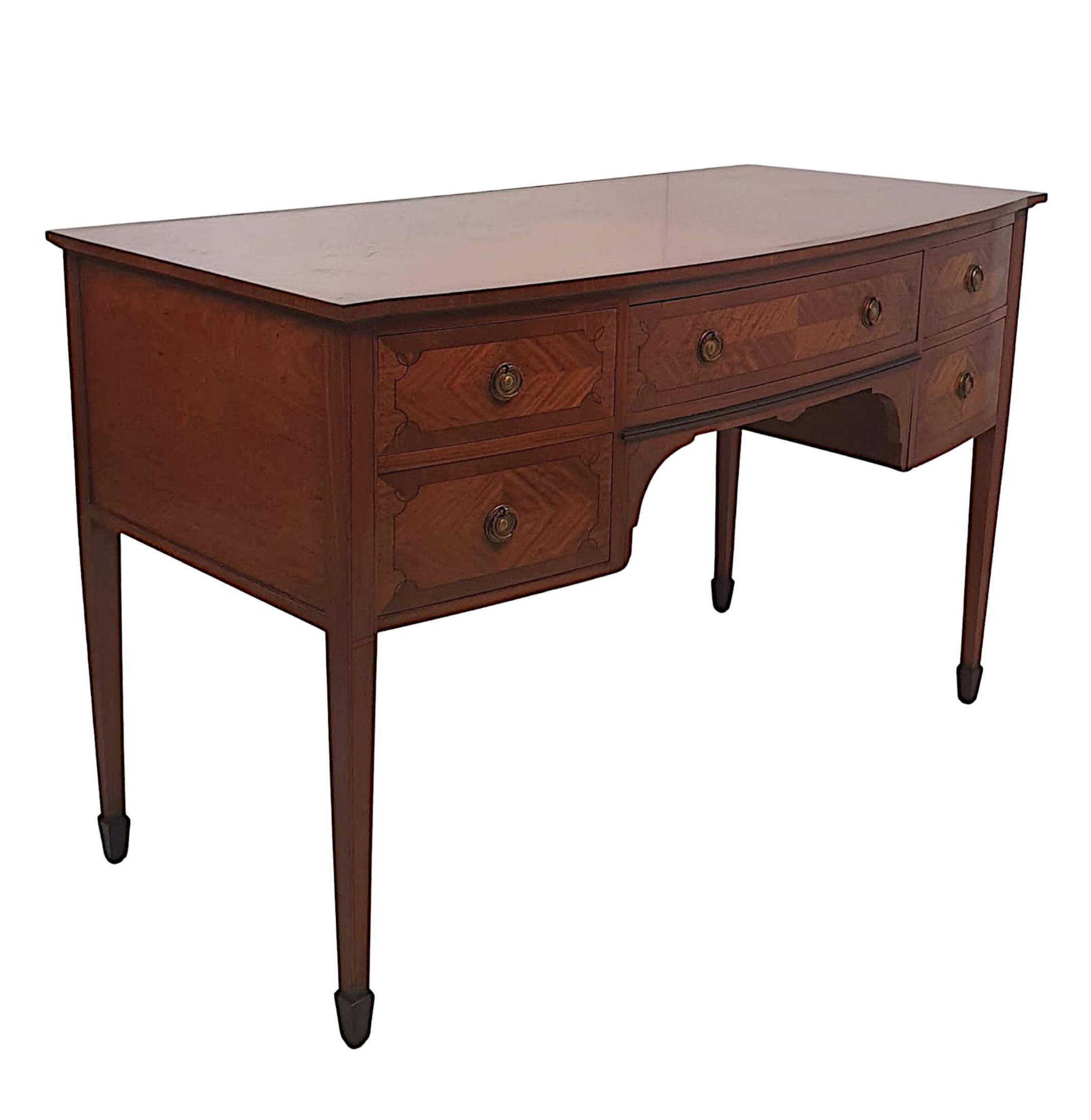 A very fine Edwardian satinwood writing desk or dressing table, the moulded cross banded top raised over shaped frieze with reeded ebonised detail and single centred long cross banded and line inlaid drawer, flanked with two short drawers, all with