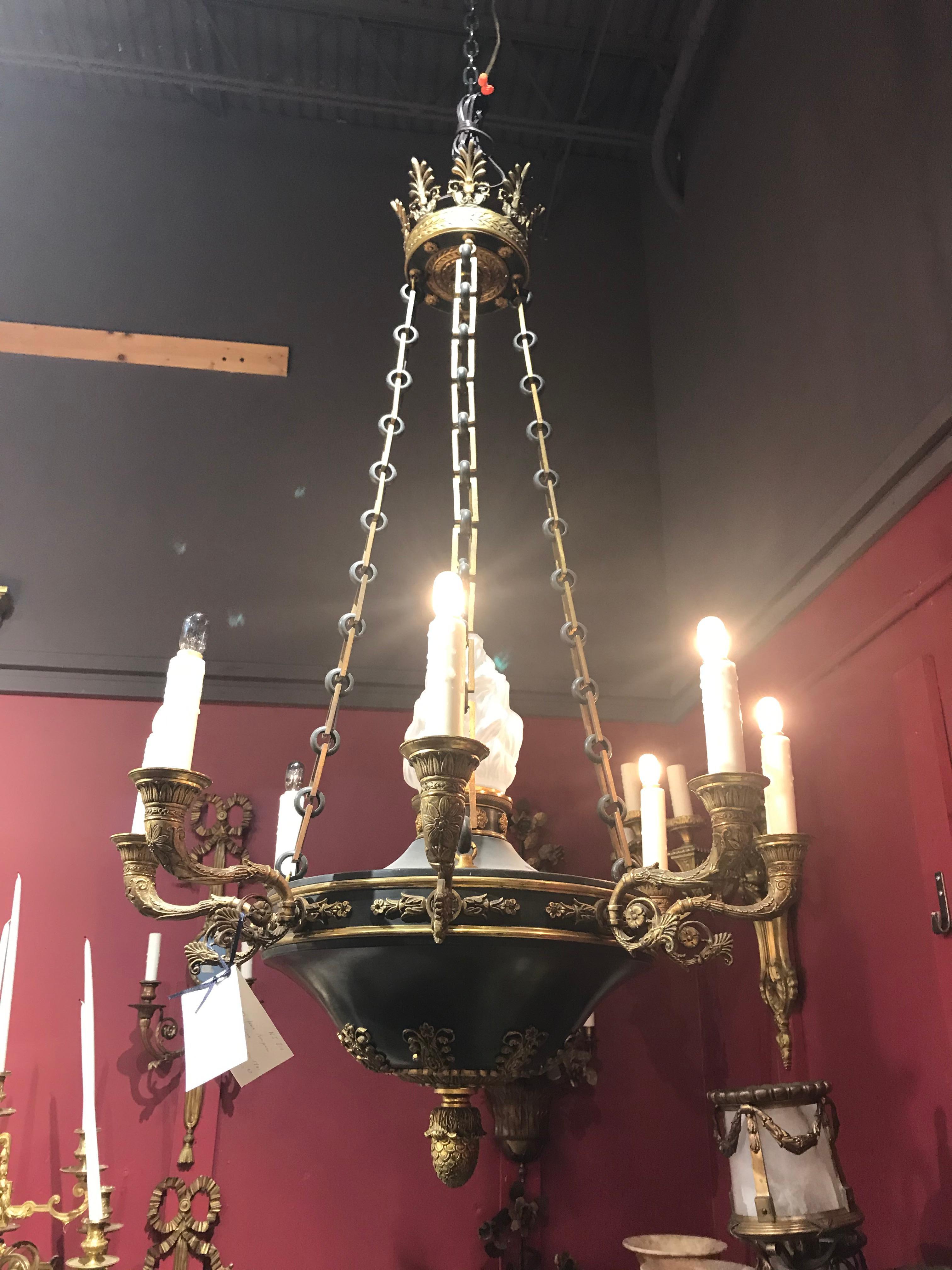 A very fine empire style chandelier. Gilt and patinated bronze body and chains, featuring crystal flame globe. 8 lights, France, circa 1900.
Dimensions: Height 44