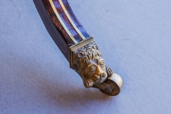 A very fine English Regency mahogany and rosewood and brass inlayed game table