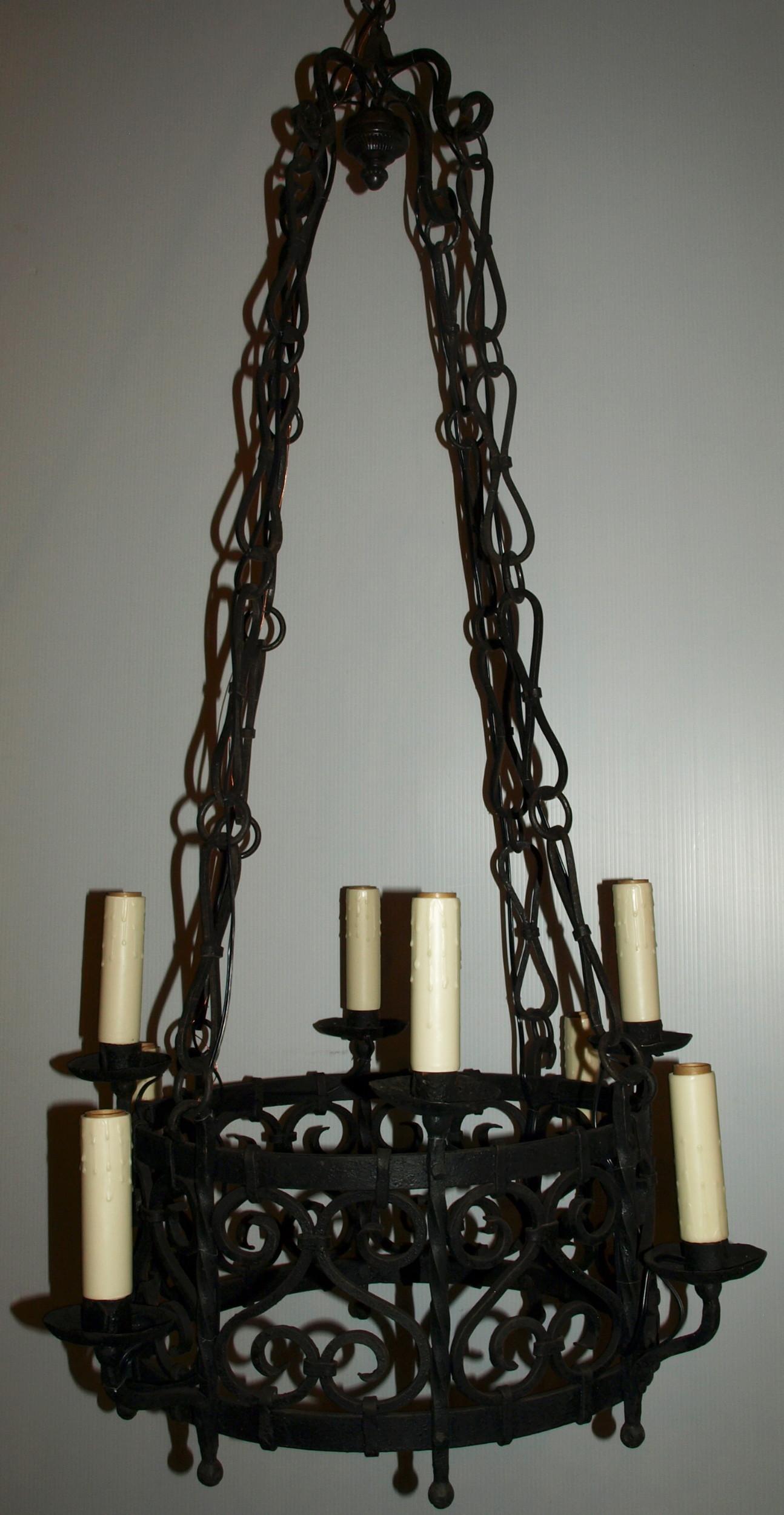 A very fine French Provincial chandelier. Wonderful ironwork, please notice that most pieces are not soldered but riveted together, France, circa 1900
Dimensions: Height 48