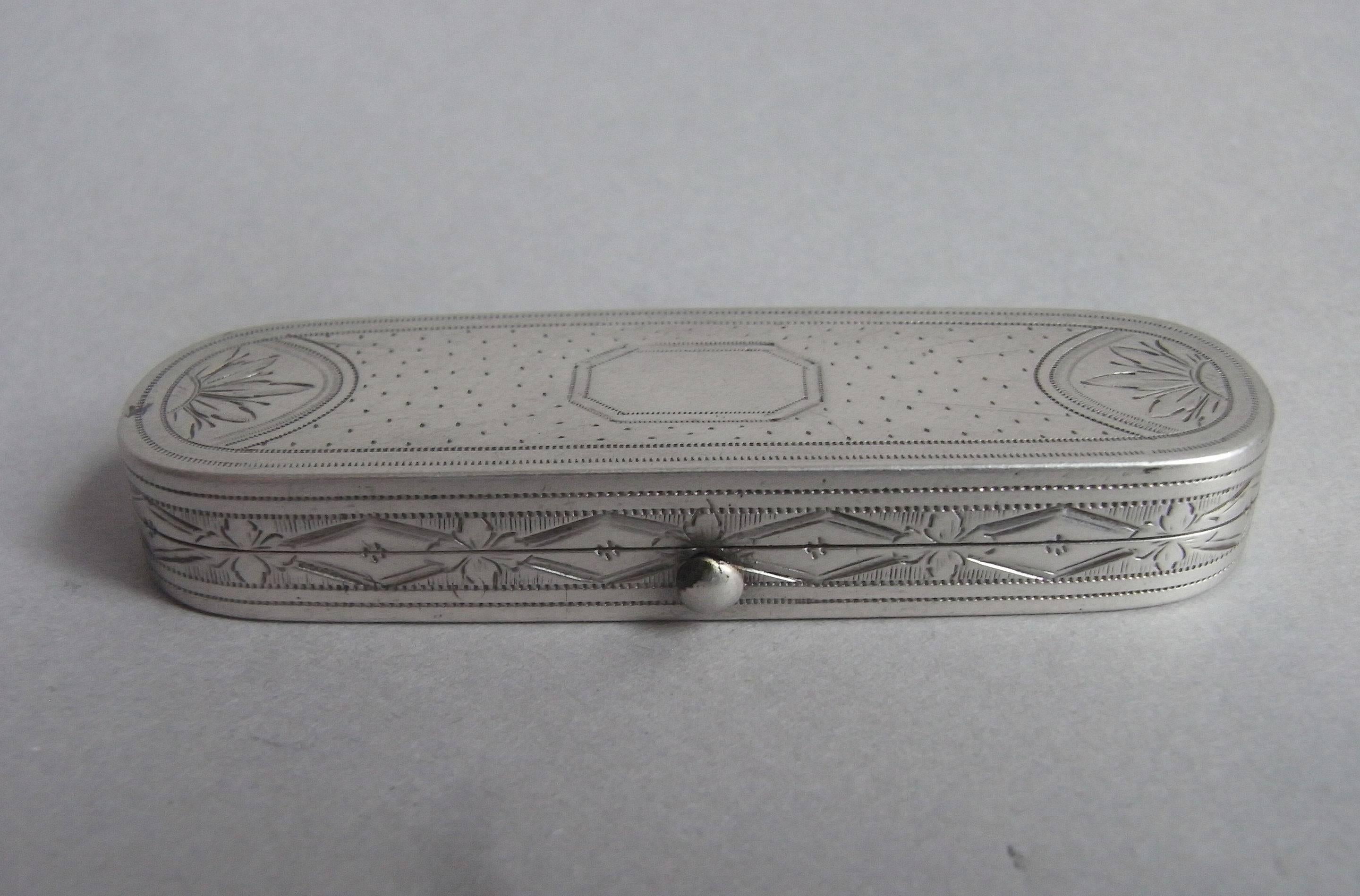 The toothpick box is of narrow rectangular form with rounded ends. The cover is engraved with sunburst design and floral motifs at each end in semi circles. The centre displays a vacant cut cornered cartouche. The sides are beautifully engraved with