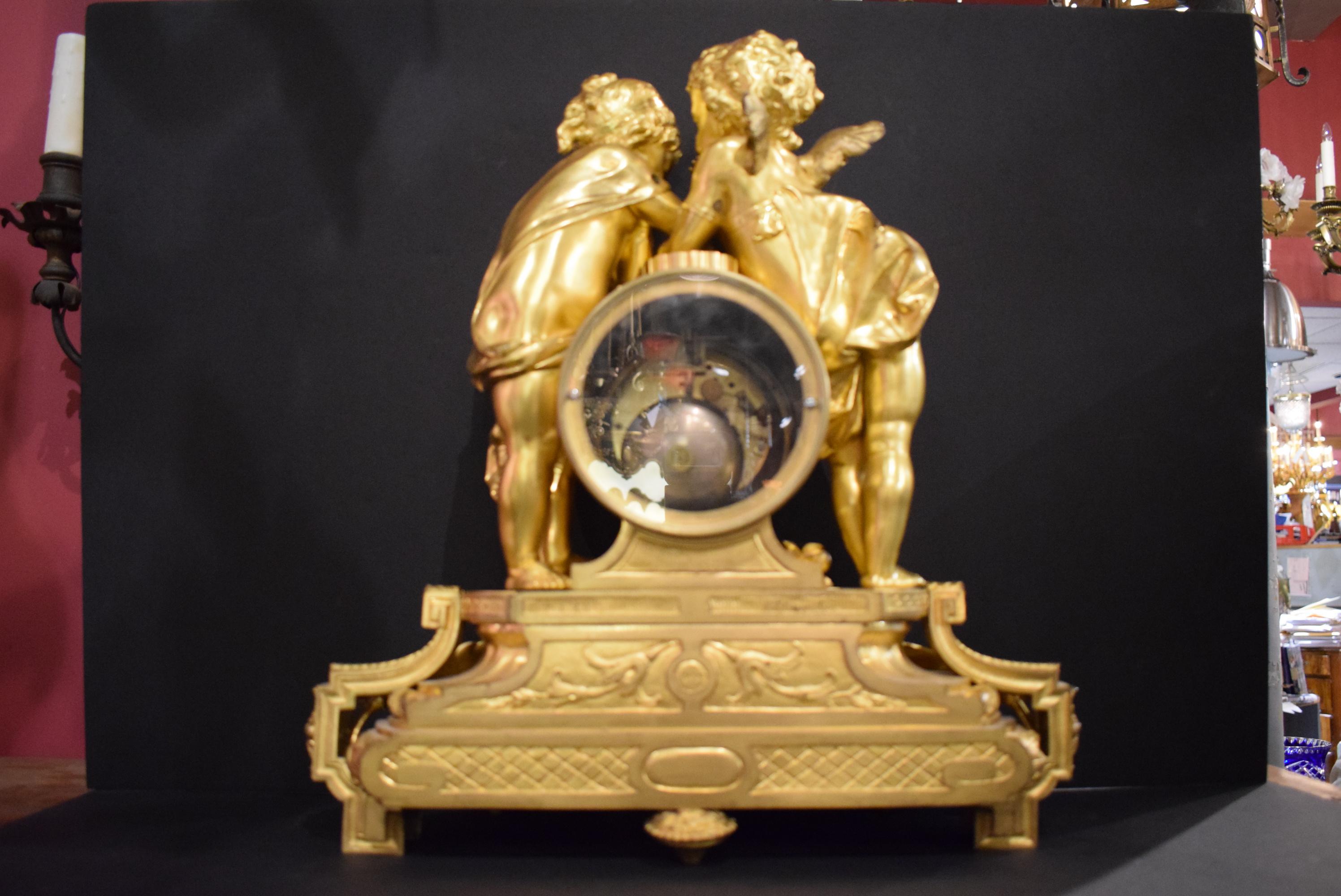 A very fine gilt bronze clock depicting infant, cupid and psyche. An exquisite Louis XVI base. Signed Prosper Roussel.
Paris, France, circa 1900
Dimensions: Height 17 1/2