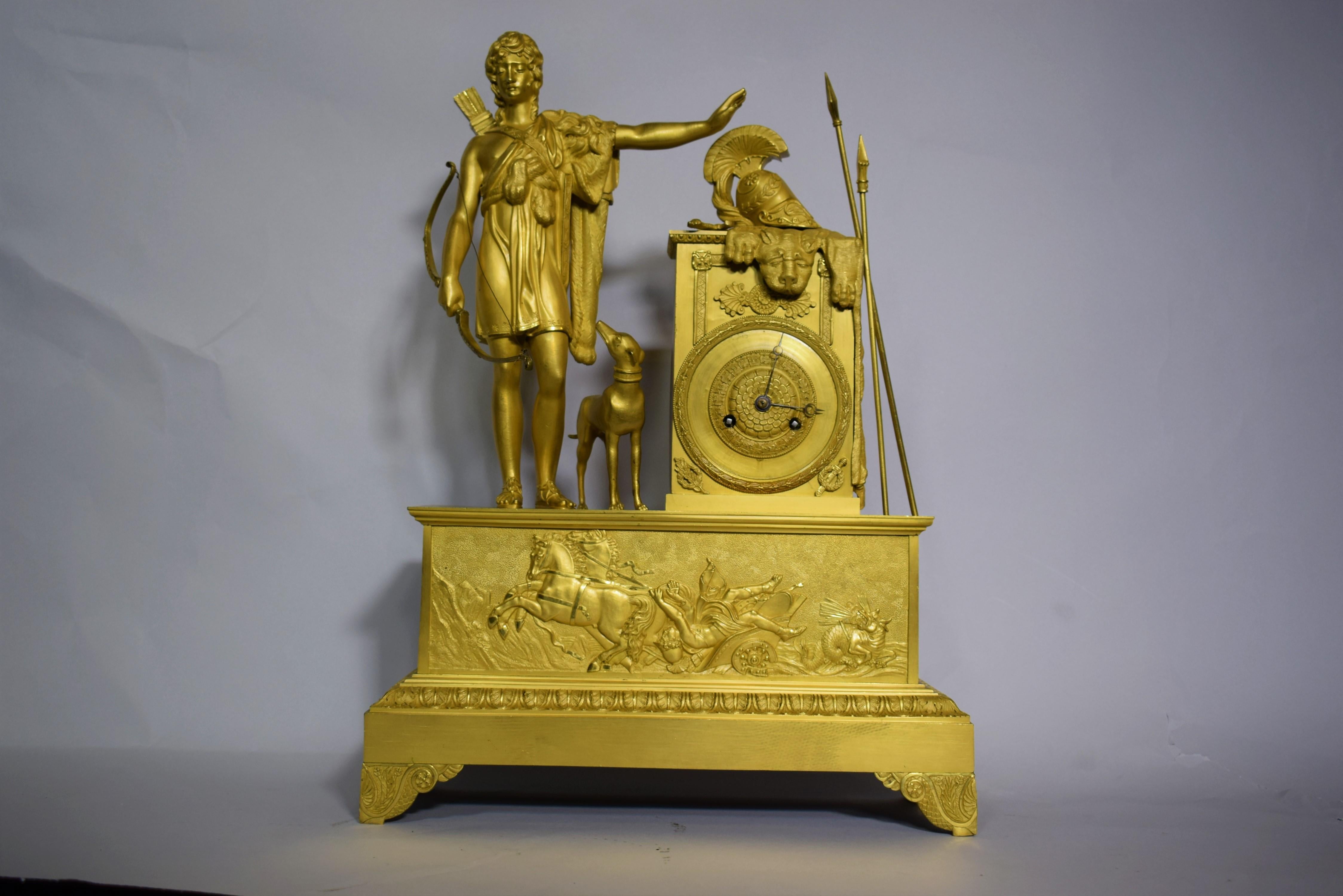 A very fine gilt bronze period Empire mantle clock. France, circa 1805.
Period Empire clock featuring an stylized Hercules with Lion's pelt. Original mercury gilding. Silk thread suspension. Dimensions: Height 21