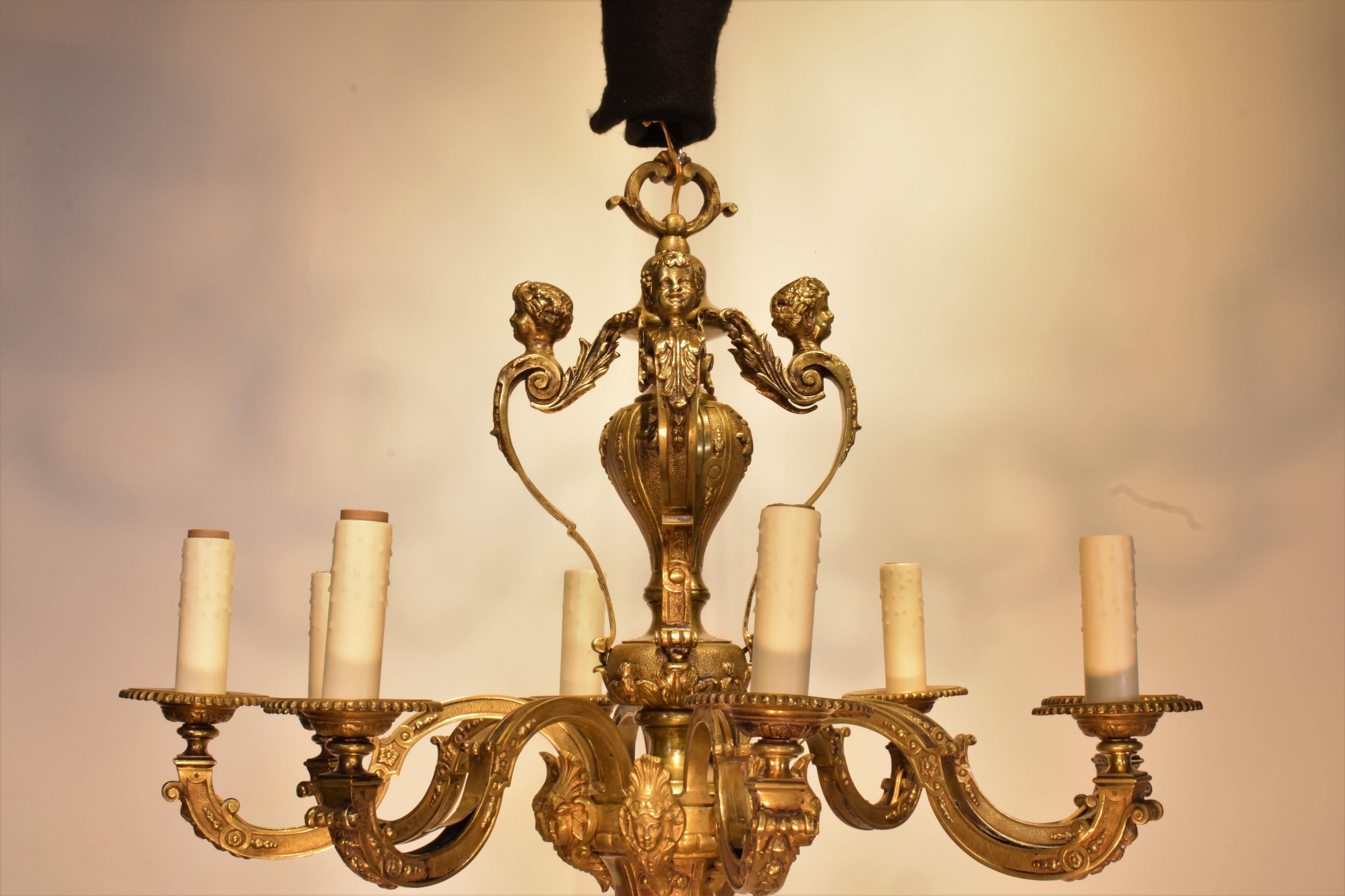 A Very Fine & Decorative Gilt Bronze Chandelier in the Regency taste. 
France, circa 1920. 8 lights
Dimensions: Height 28