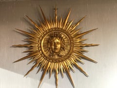Very Fine Giltwood Sunburst Ornament Depicting the Head of Apollo