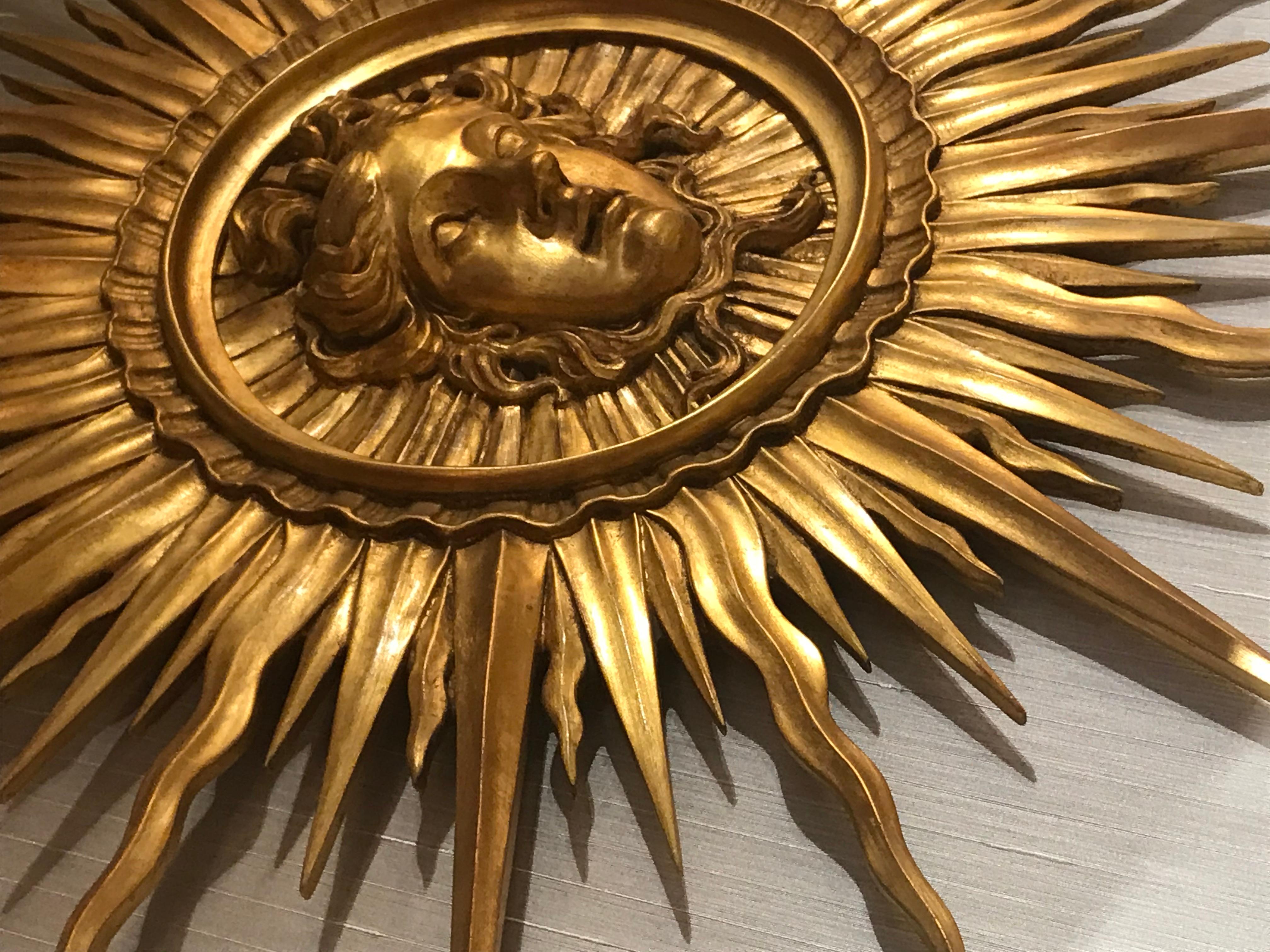 Wood Very Fine Giltwood Sunburst Ornament Depicting the Head of Apollo