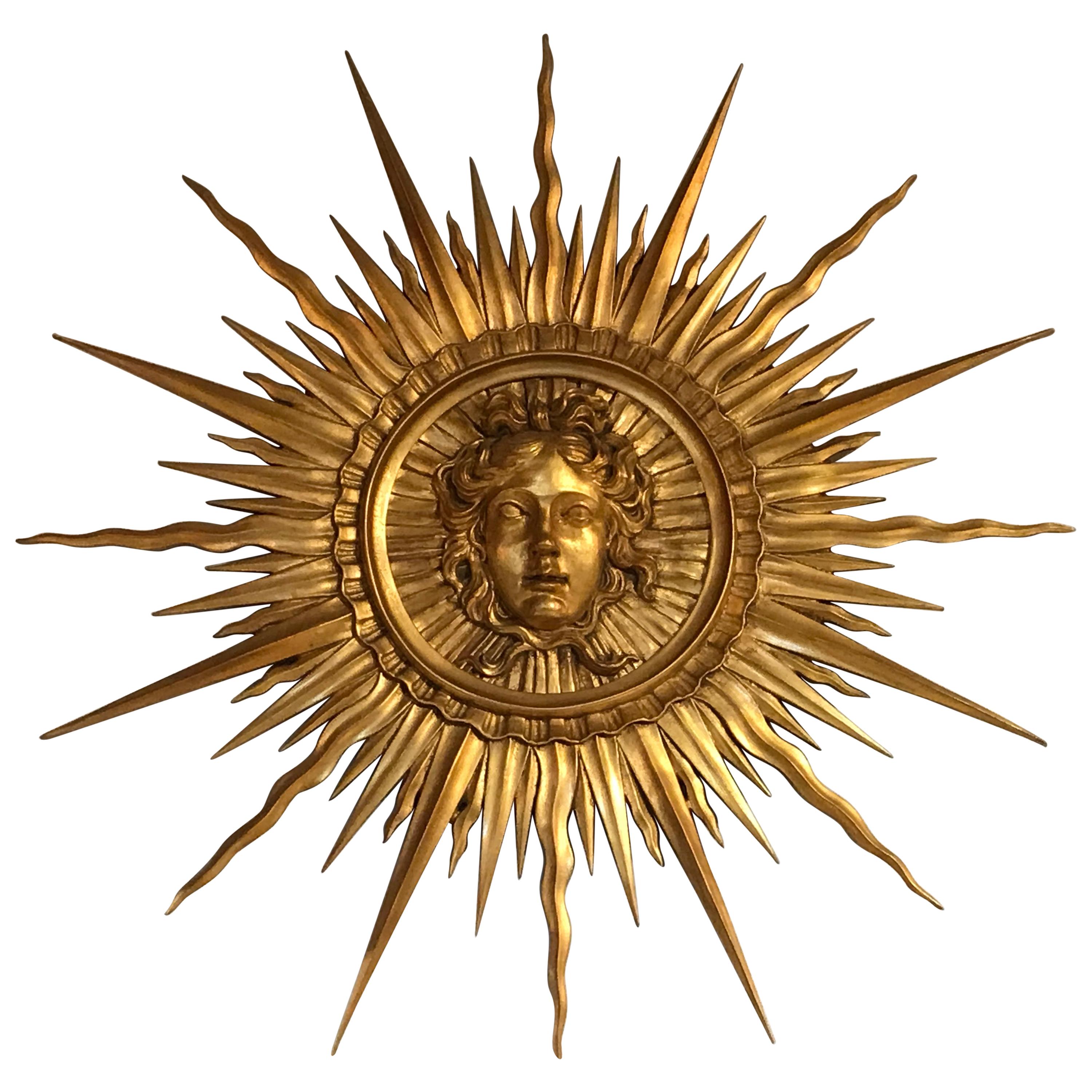 Very Fine Giltwood Sunburst Ornament Depicting the Head of Apollo
