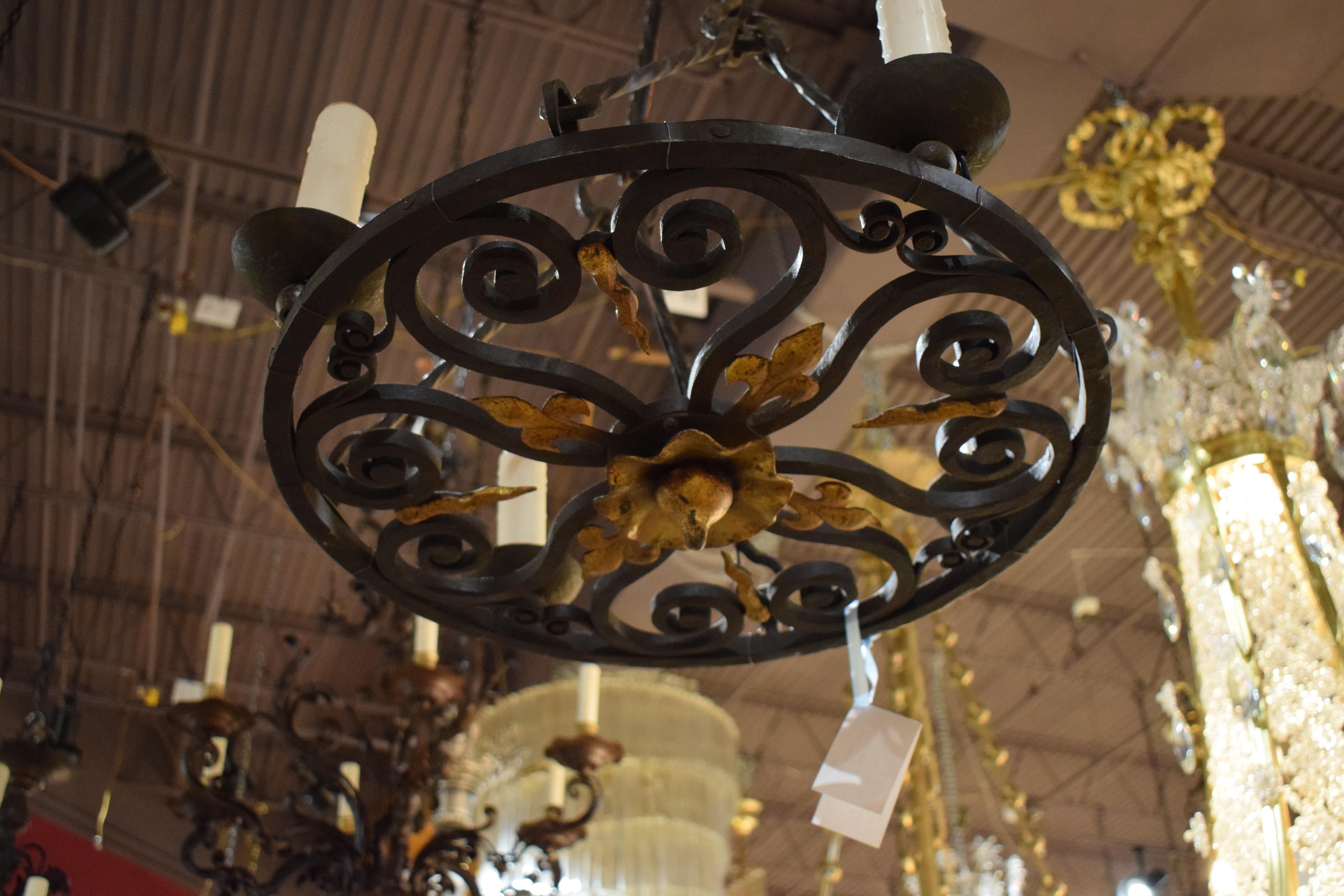 A very fine hand forged iron chandelier. France, circa 1910. 4 Lights. 
Dimensions: Height 28