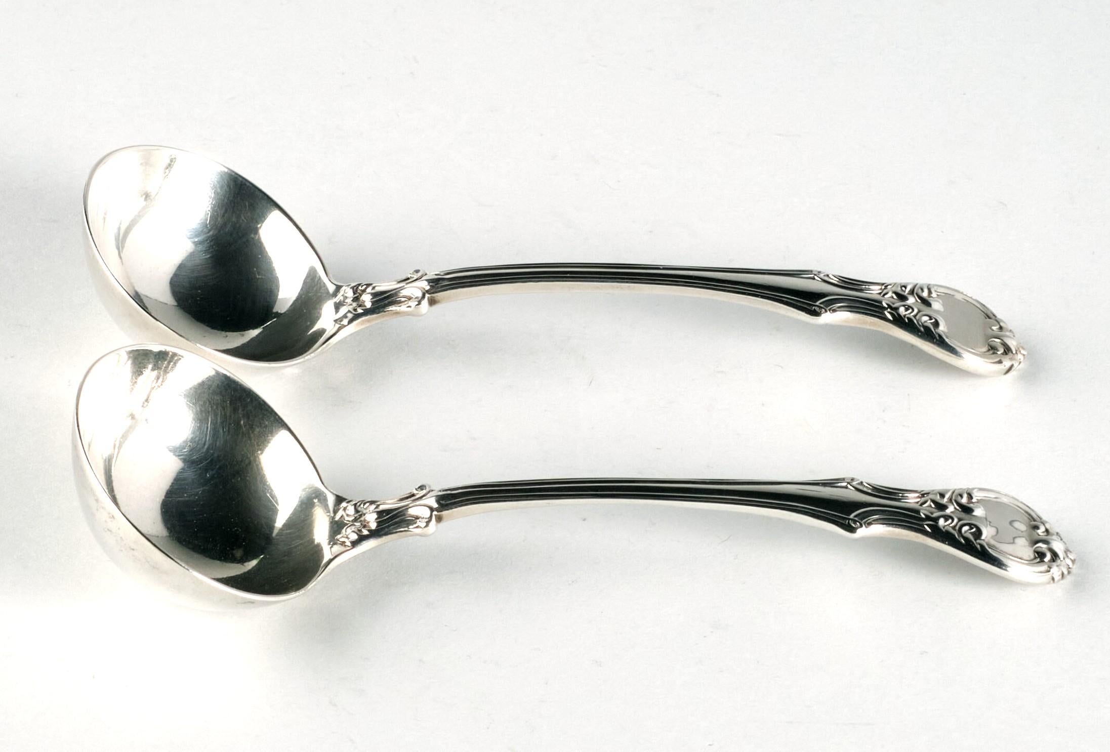 A very attractive & heavy pair of Mid-19th century sterling silver sauce ladles. 
Both cast in the seldom seen ‘Victoria’ pattern, with deep welled oval bowls rising to foliate shouldered stems with foliate & scroll sculpted terminals. 
The reverse