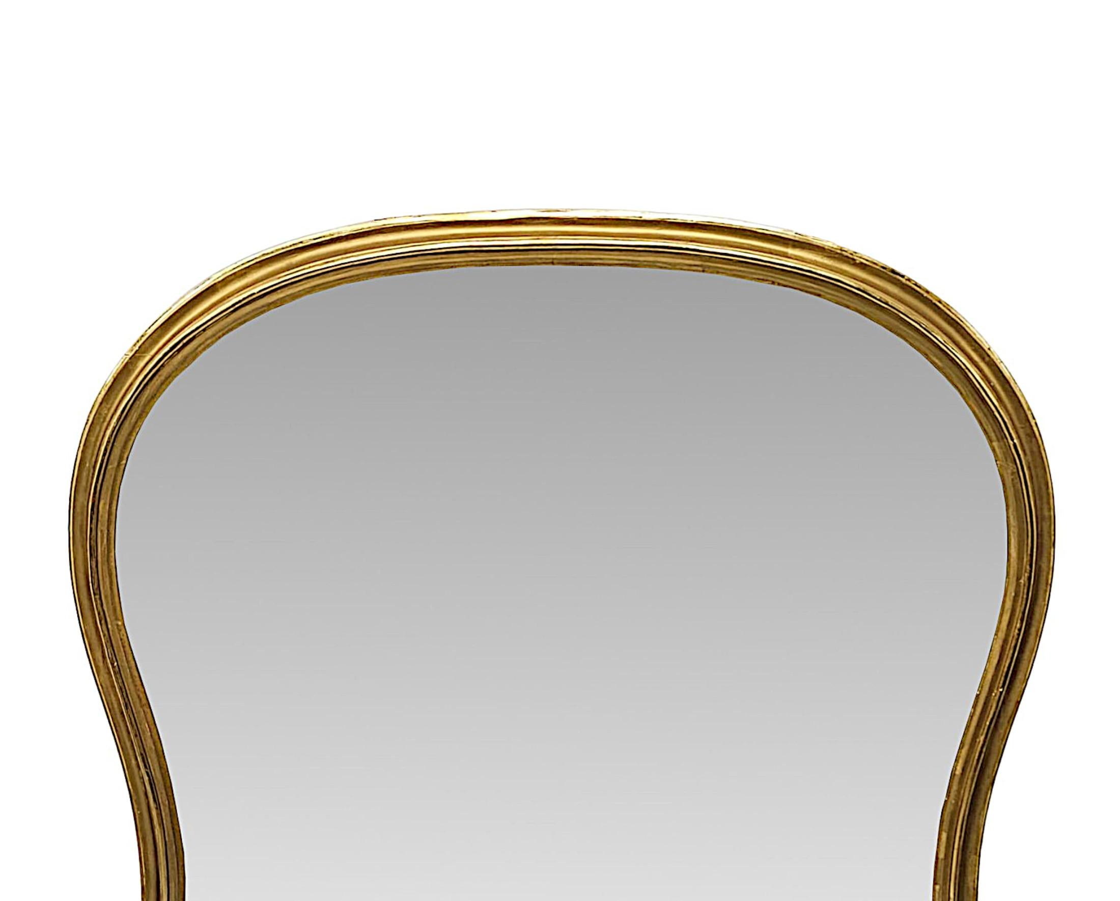 A very fine 19th Century waisted archtop giltwood overmantel mirror, of large proportions and exceptional quality.  The shaped mirror glass plate is set within an elegantly simple and stunningly hand carved, moulded, fluted and pierced giltwood