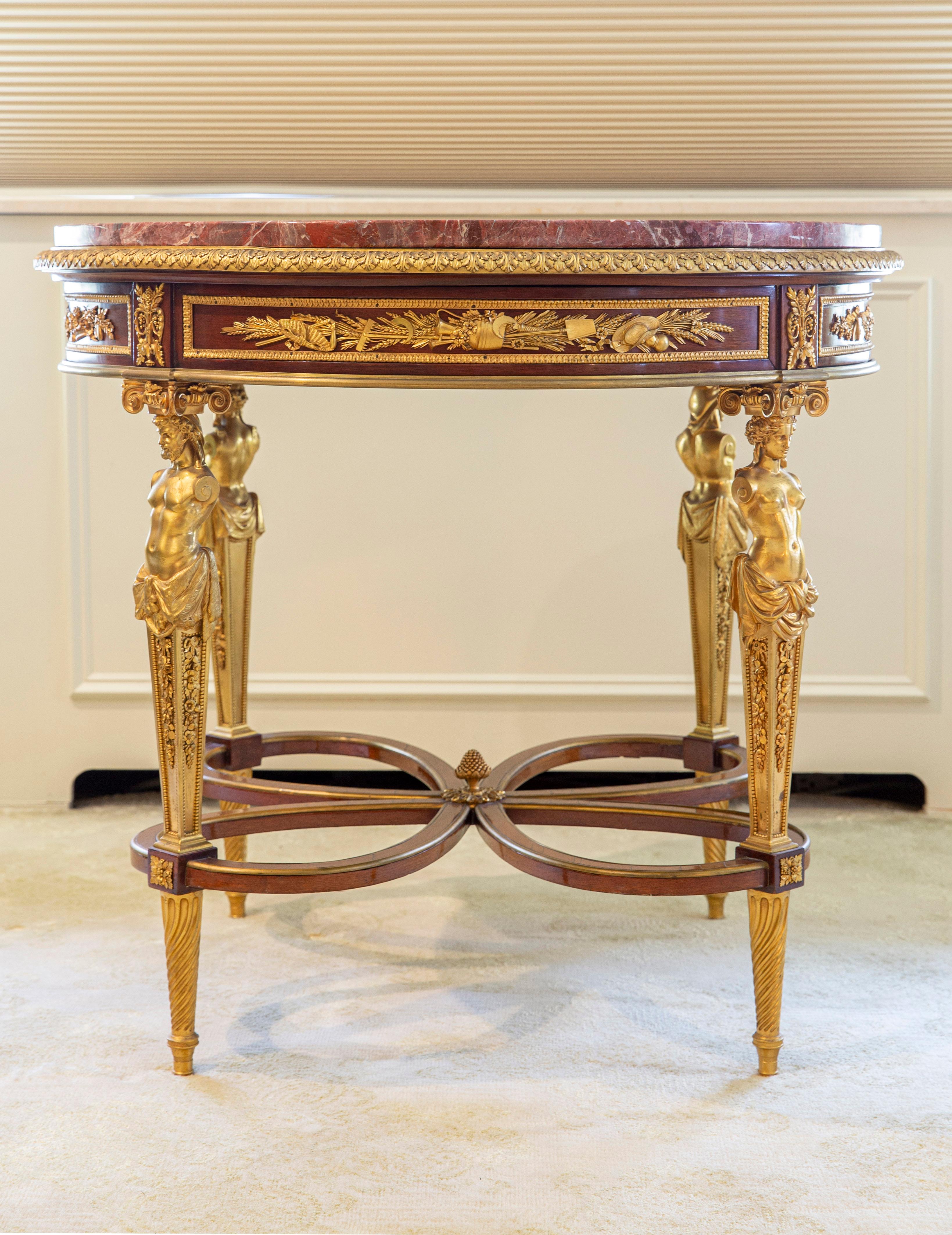 A Very Fine Late 19th Century Louis XVI Style Gilt Bronze Mounted Center Table by Henry Dasson

Henry Dasson

The brèche rouge circular marble top above a frieze mounted with allegorical trophies emblematic of the four seasons amid scrolling foliage