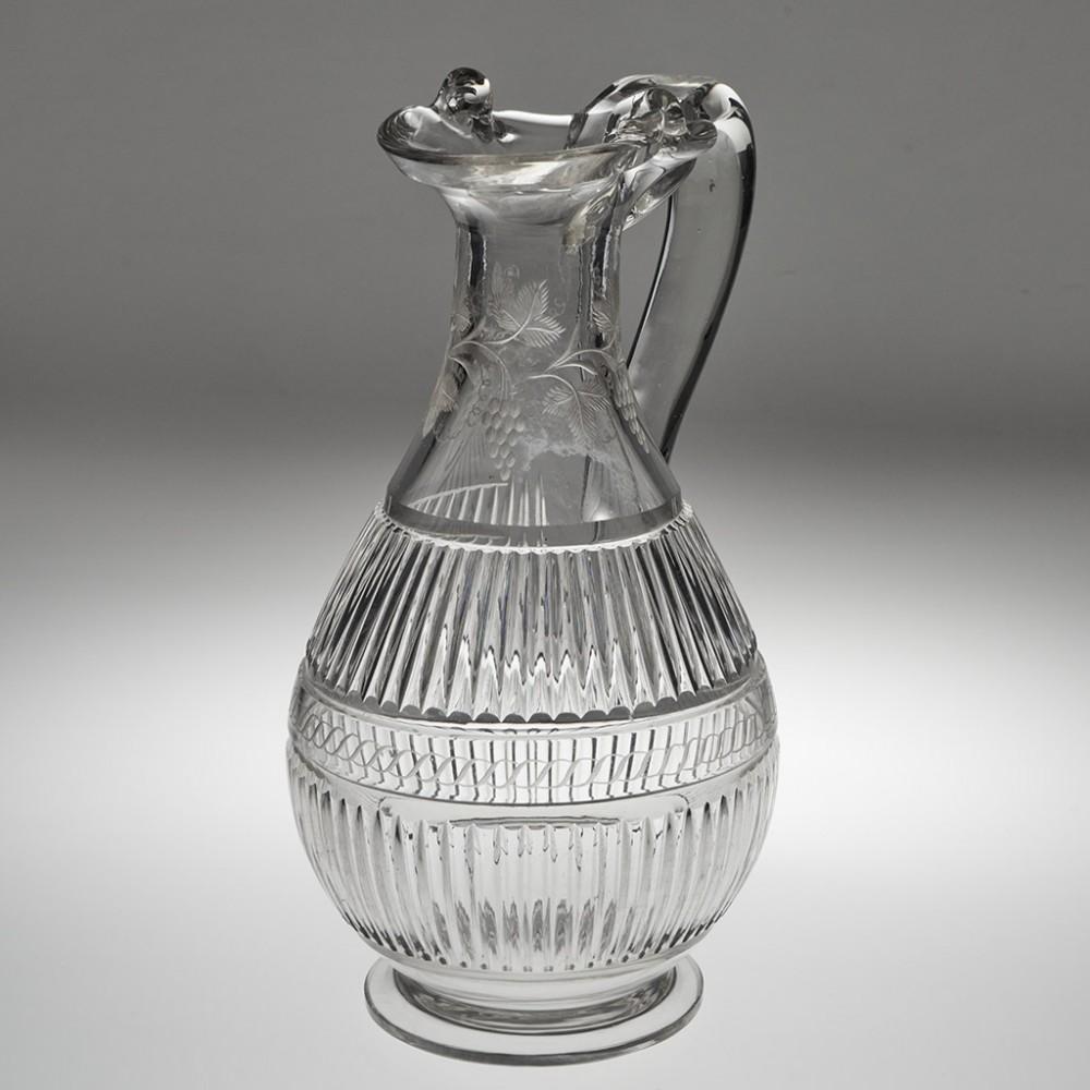 A Very Fine Magnum Glass Claret Jug, c1850

Additional information: 
Date : 1840-60
Period : Victoria
Origin :  England
Colour : Clear, pale grey hue
Neck : Engraved with fruiting vines
Body : Baluster shape with swan neck top down handle with spade