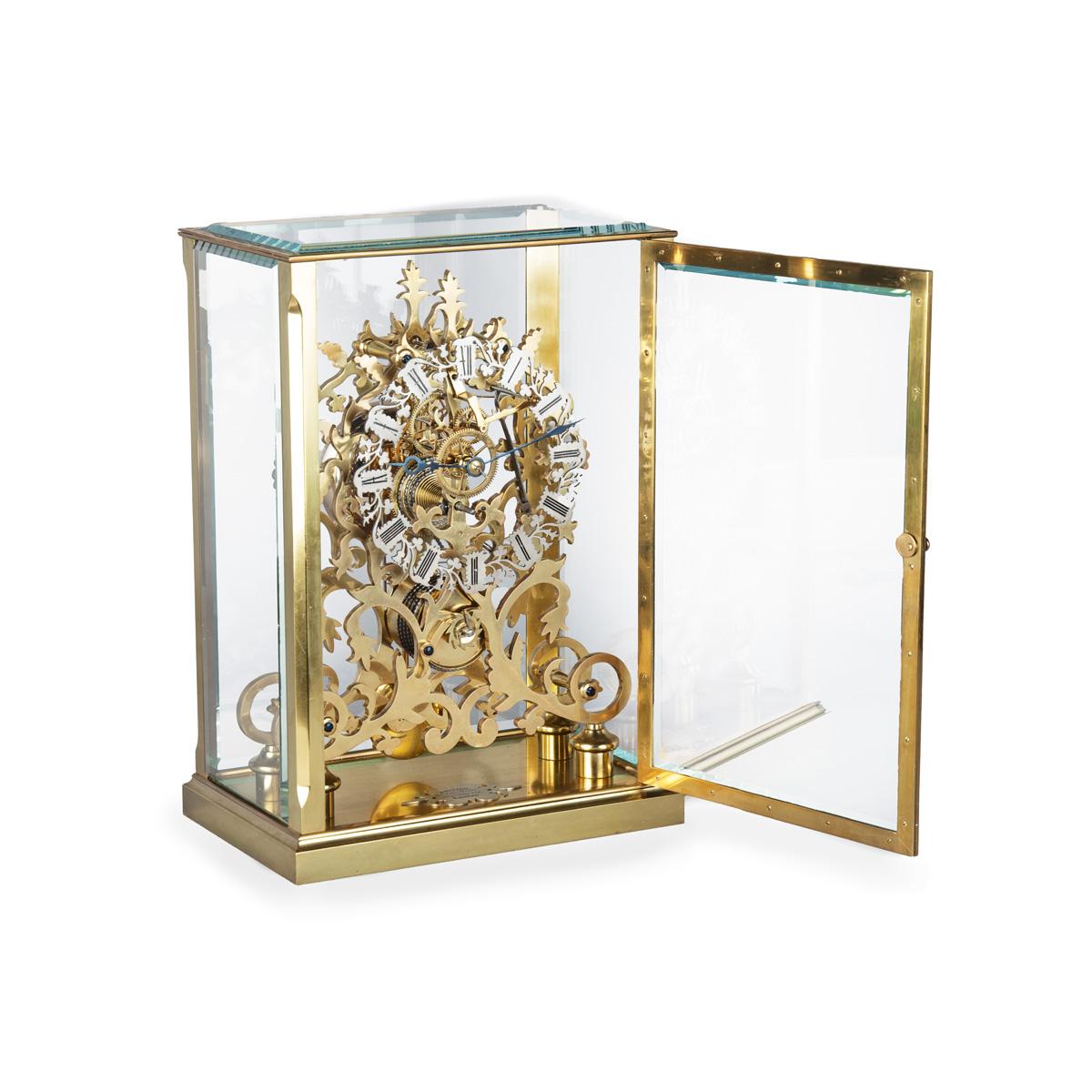 A very fine mid Victorian skeleton clock by Johnston of London, of large rectangular form comprising two openwork arabesque panels parti A very fine mid Victorian skeleton clock by Johnston of London, of large rectangular form comprising two