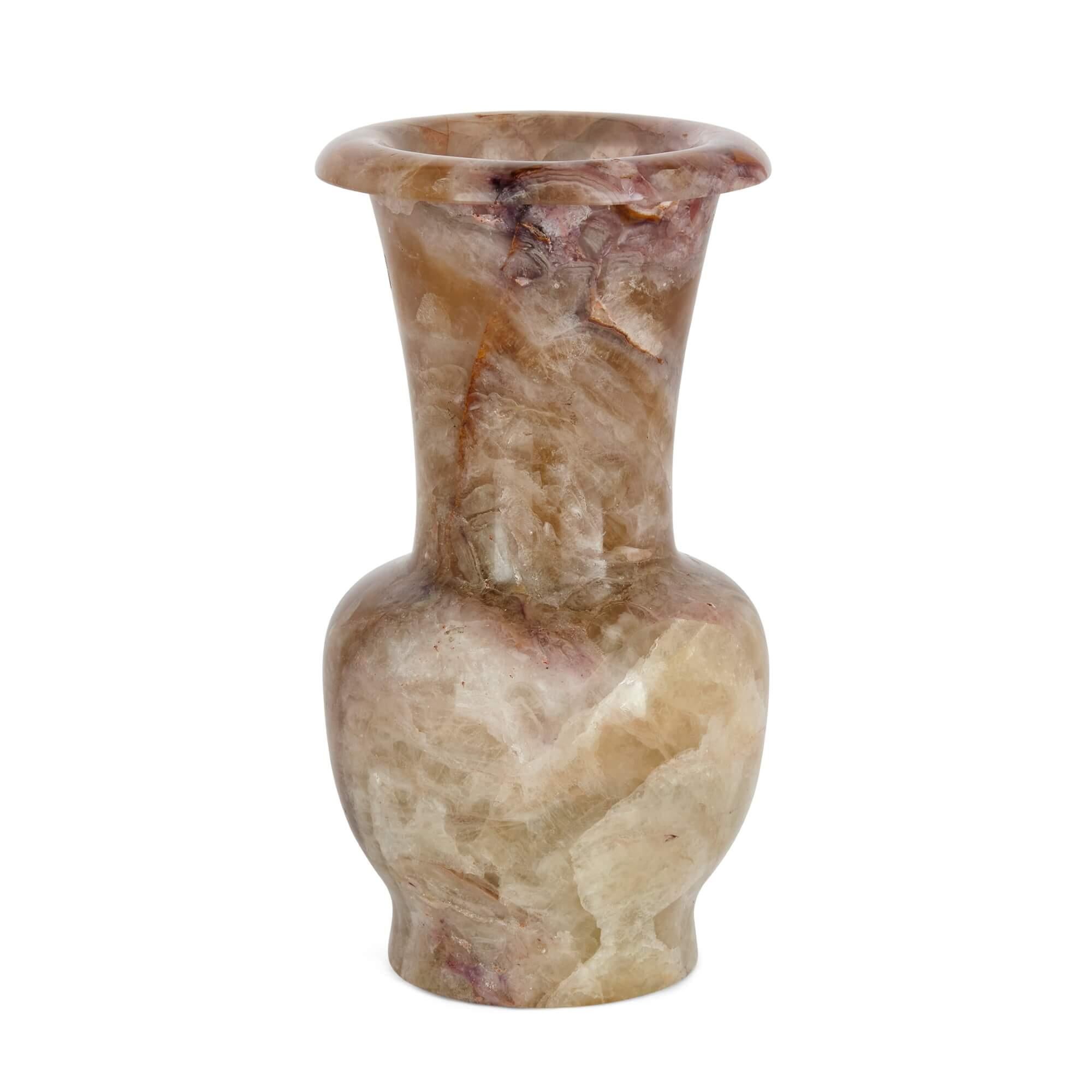 A very fine mineral specimen vase made from fluorspar
Continental, 20th Century
Measures: height 22cm, diameter 12cm

This small, elegant, and vibrant piece is an excellent decorative piece, carved from the precious mineral fluorspar. Also known