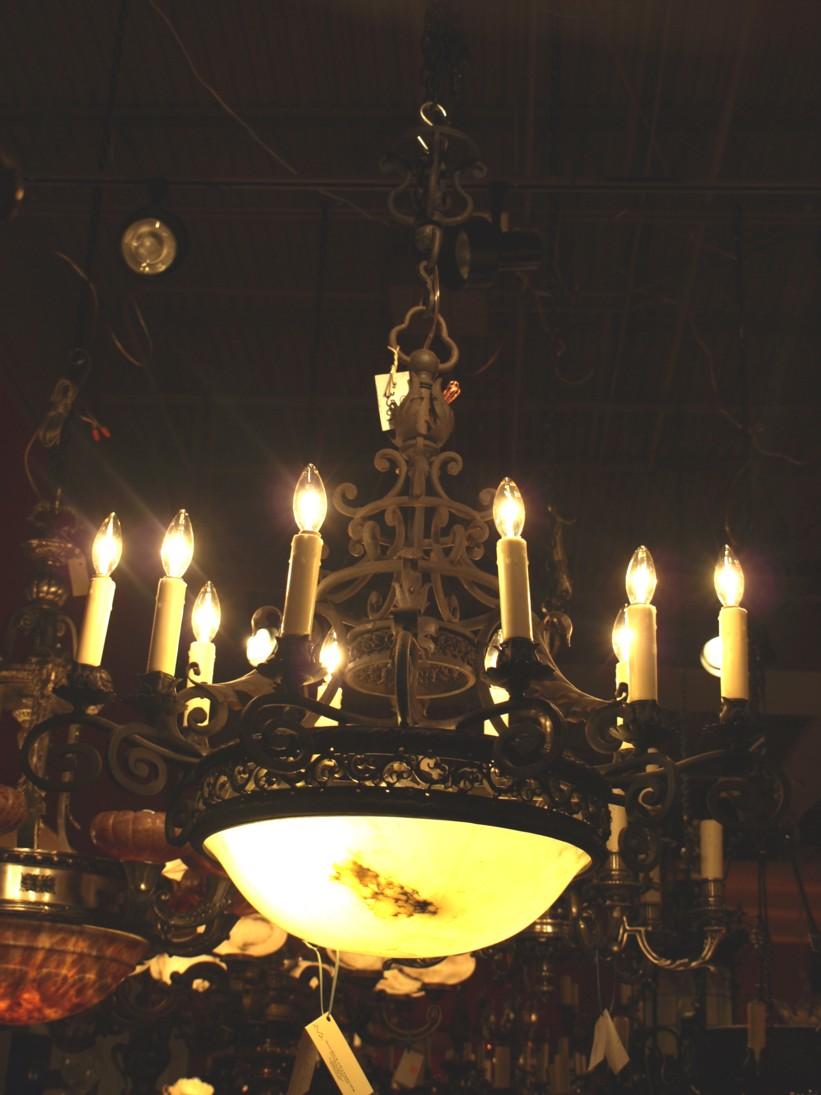 A very fine painted bronze & Alabaster chandelier. France, circa 1930. 14 Lights (10 outside & 4 inside).
Dimensions: Height 38