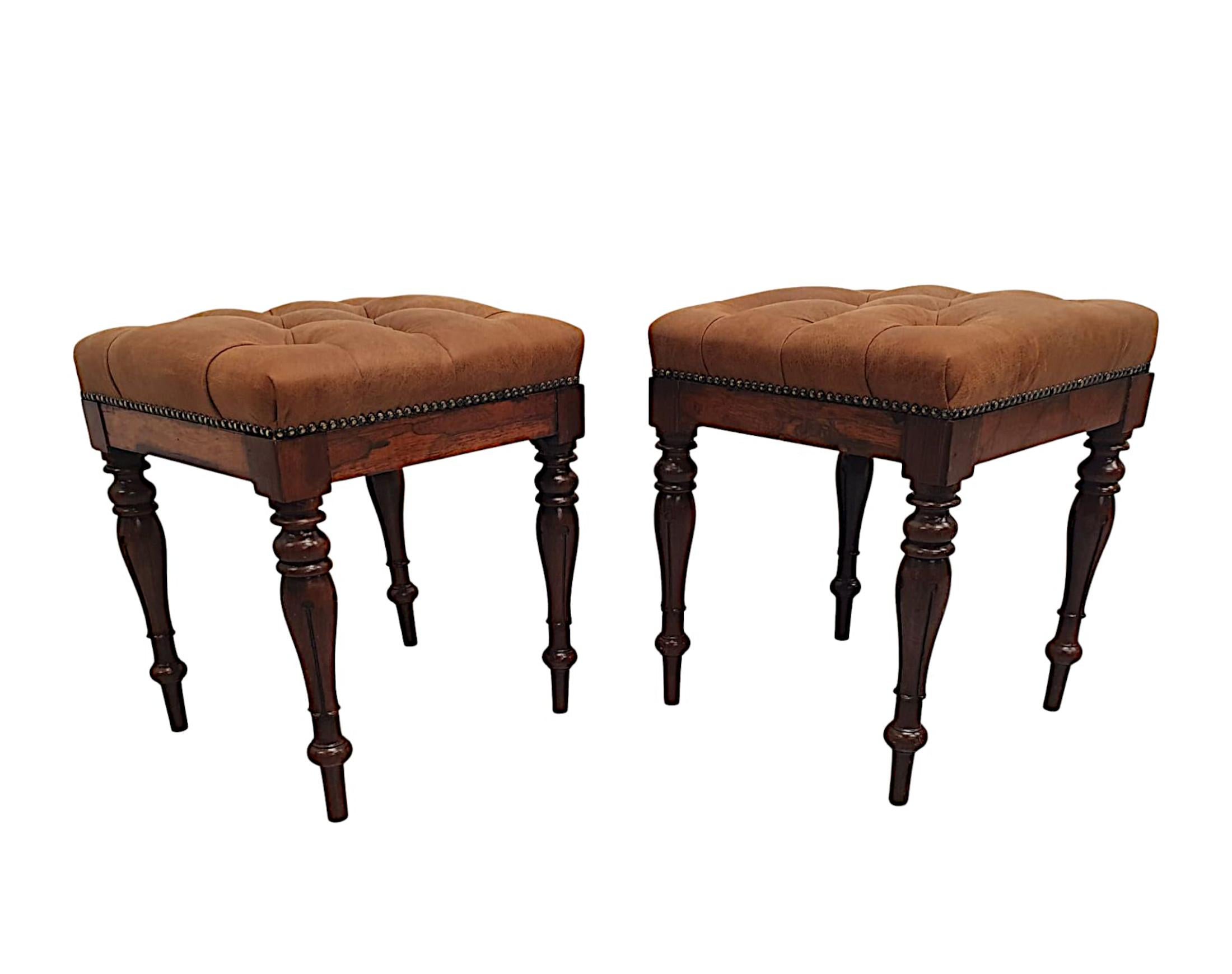 A very fine pair of early 19th century fruitwood stools, finely hand carved with gorgeously rich patination and grain. The padded, deep buttoned seat is of square form and upholstered in fabulous tan leather with brass studded trim. Raised over